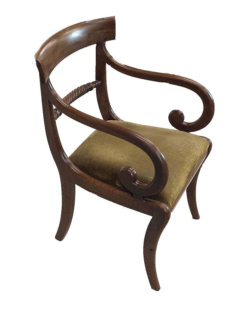 English Regency mahogany armchair, bowed crest rail with arched edge above the rope carved lumbar rail. The sweeping back legs, beautifully scrolled arms and graceful saber shaped front legs along with an aged patina and color make this a very