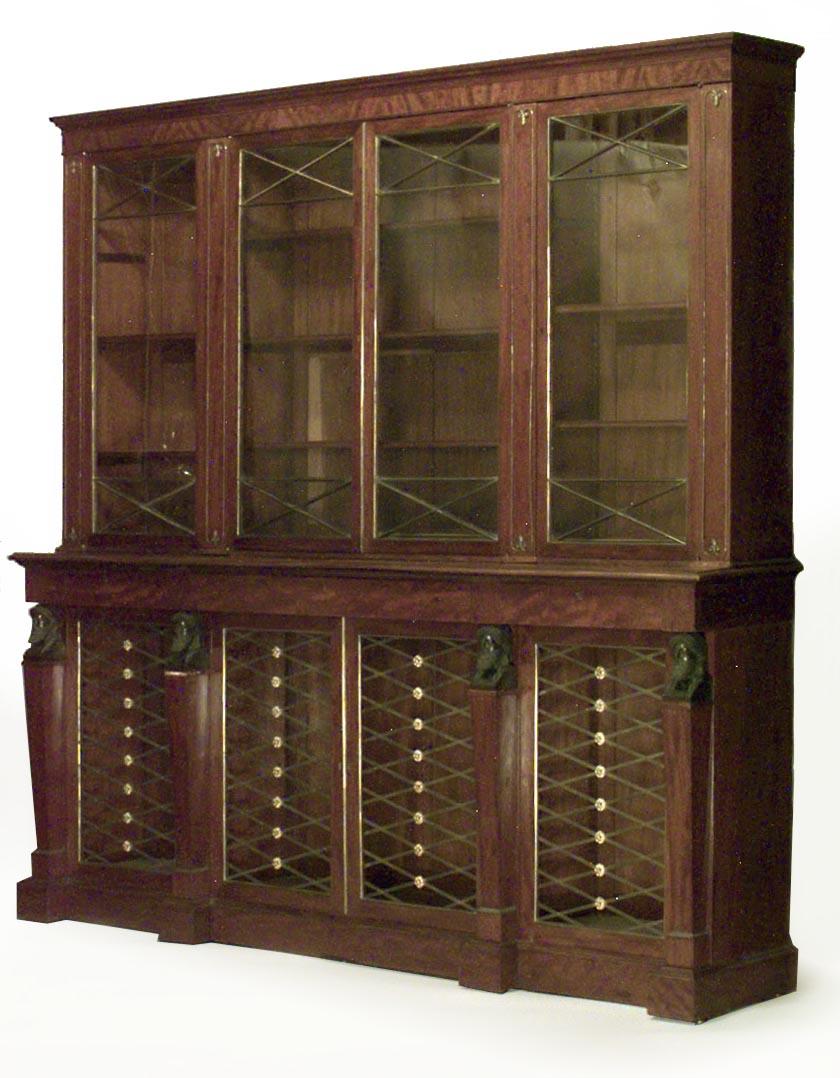 English Regency mahogany bookcase with 8 brass lattice doors and bronze classical Grecian heads.
