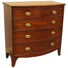 English Regency Mahogany Bow Front Chest with Brass Ovals