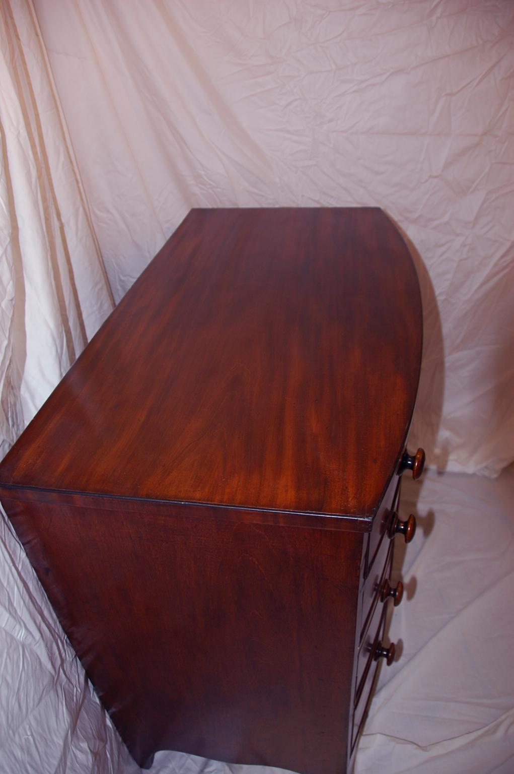 Early 19th Century English Regency Mahogany Bowfront Chest of Four Graduated Drawers