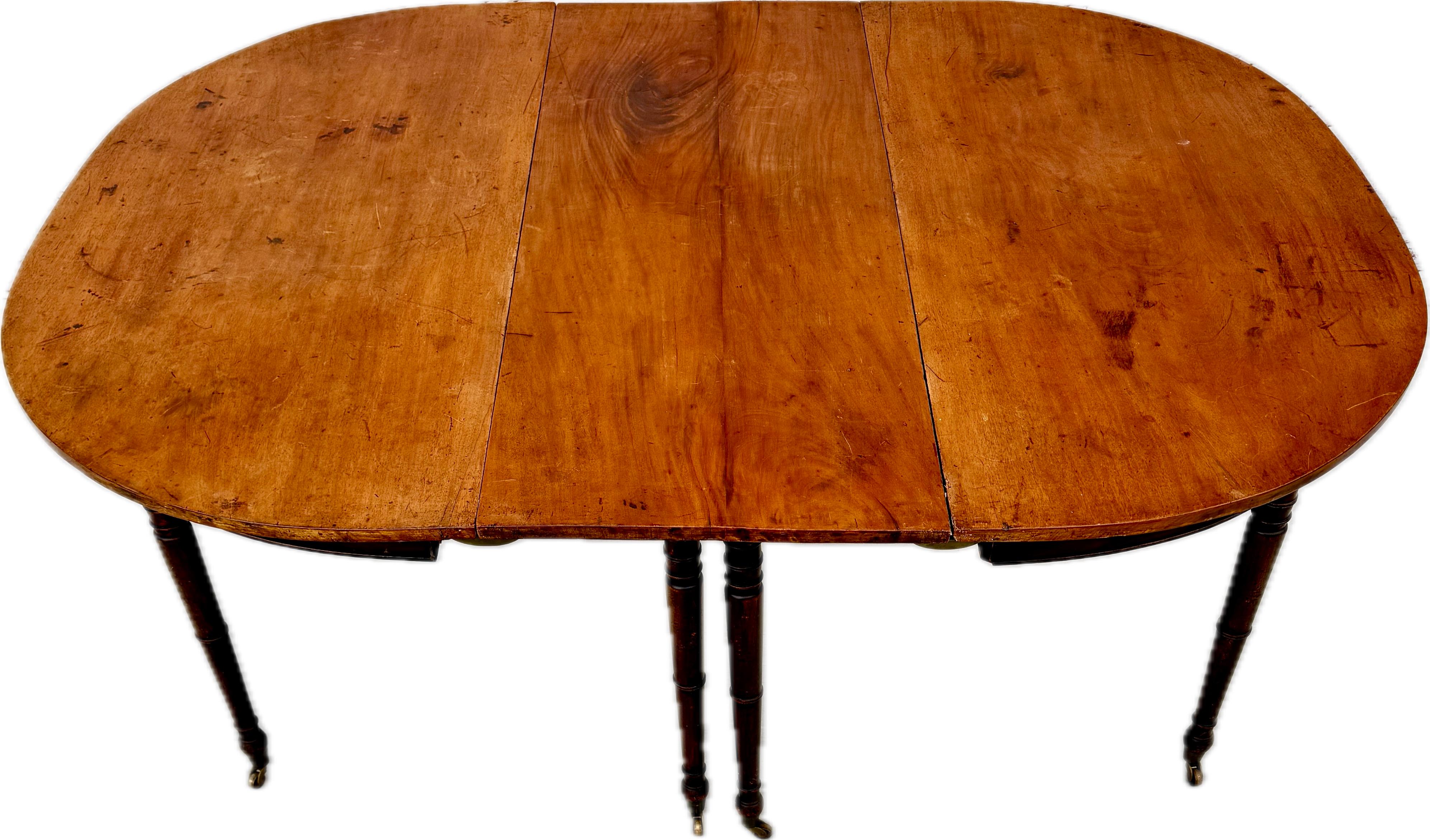 Early 19th Century English Regency Mahogany Period Dining Table. (c.1820-1840). Three sections with two D shape ends and one original leaf. Extremely well-figured solid mahogany.