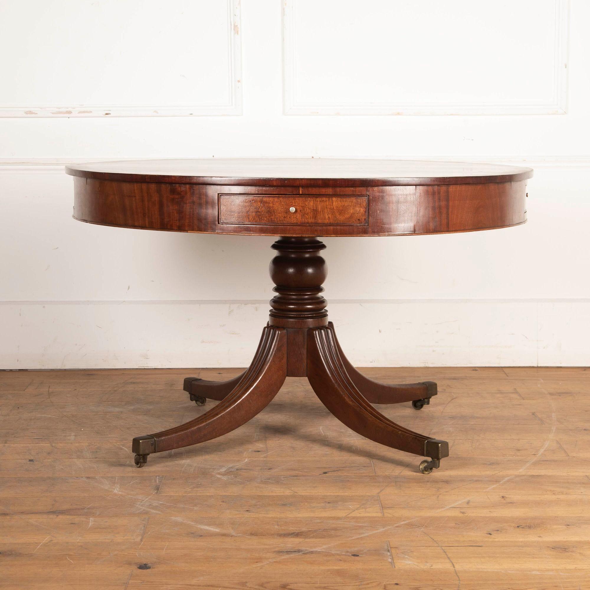 English Regency mahogany cross banded drum table.
Circa 1810.