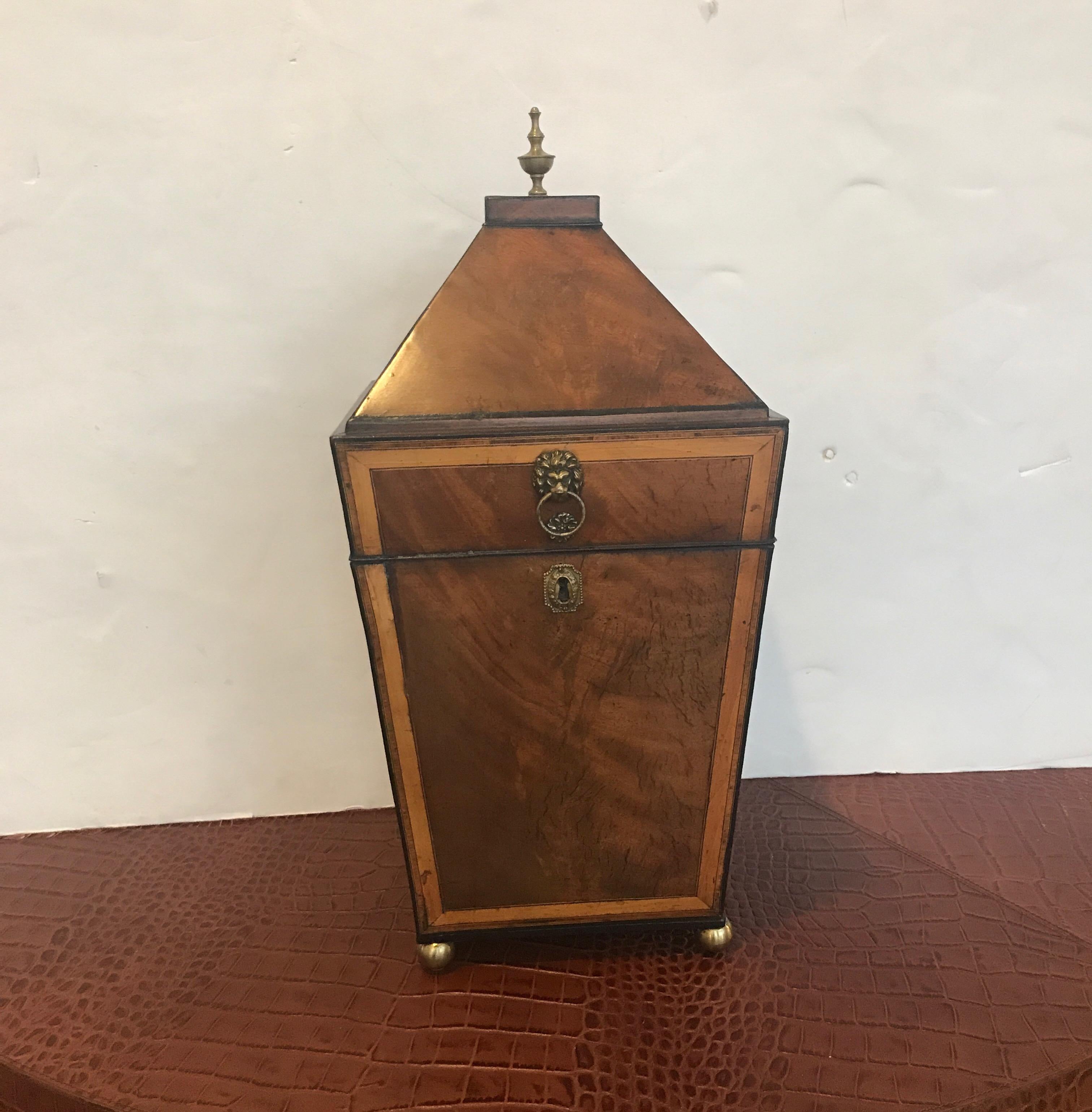 A fine of the period English Regency mahogany inlaid with satinwood knife box with brass balled feet, England, circa 1820s.