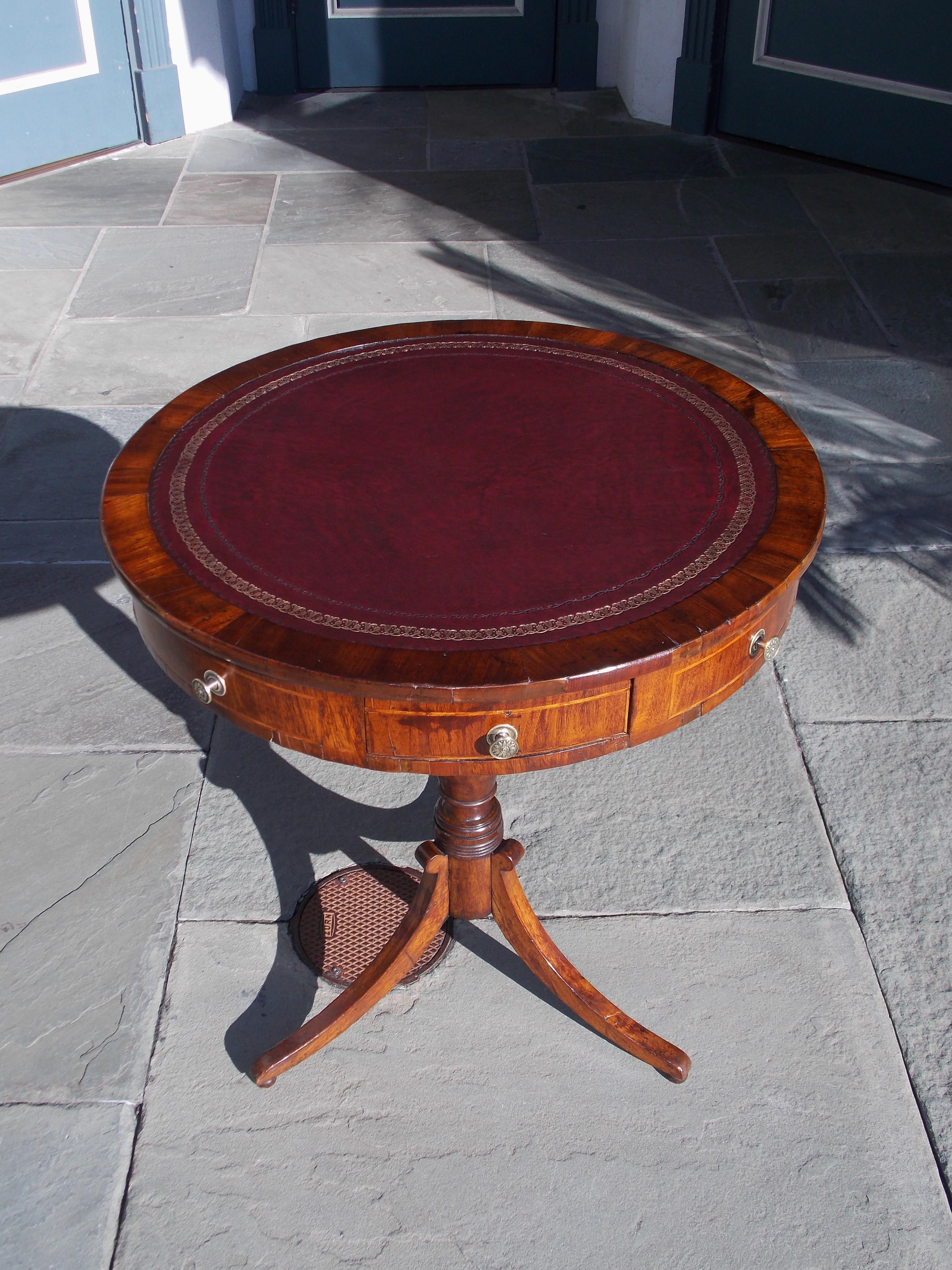 Hand-Carved English Regency Mahogany Satinwood Inlaid Leather Top Drum Table, Circa 1815