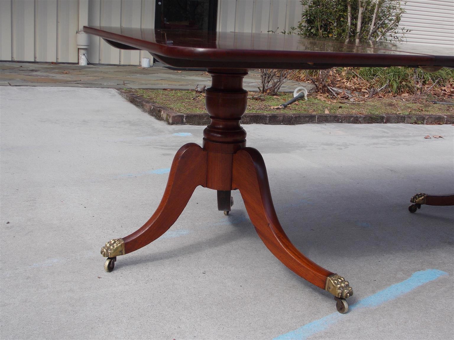 Early 19th Century English Regency Mahogany Triple Pedestal Dining Room Table with Casters, C. 1810