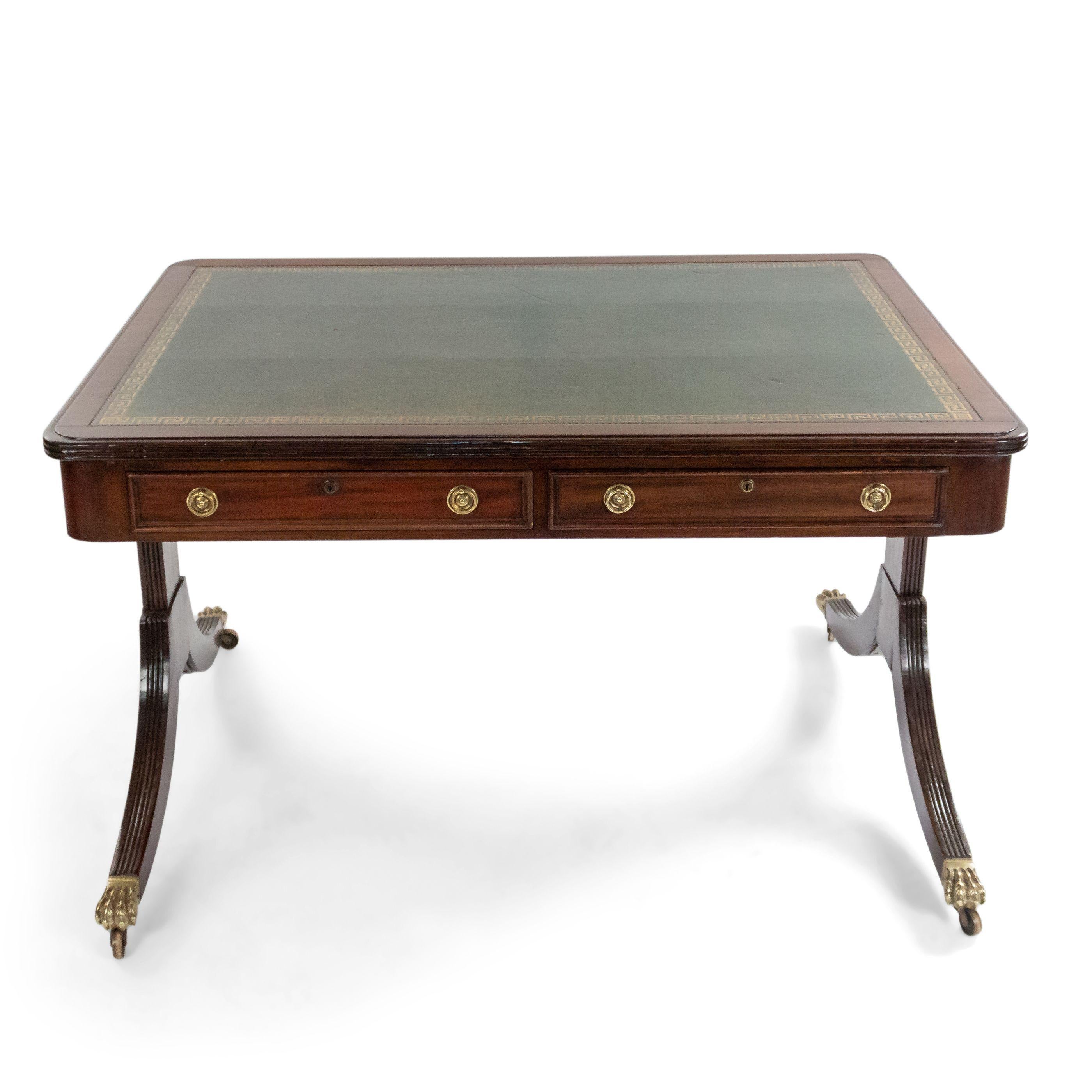 19th century English Regency style mahogany writing table (desk) with inset green leather top above 2 frieze drawers to either side on trestle supports and splayed legs.