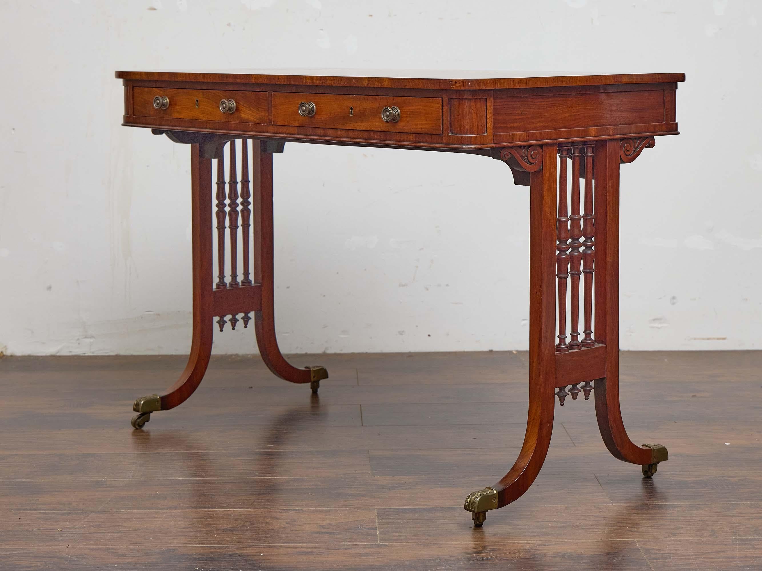English Regency Mahogany Writing Desk with Pierced Sides and Casters In Good Condition For Sale In Atlanta, GA