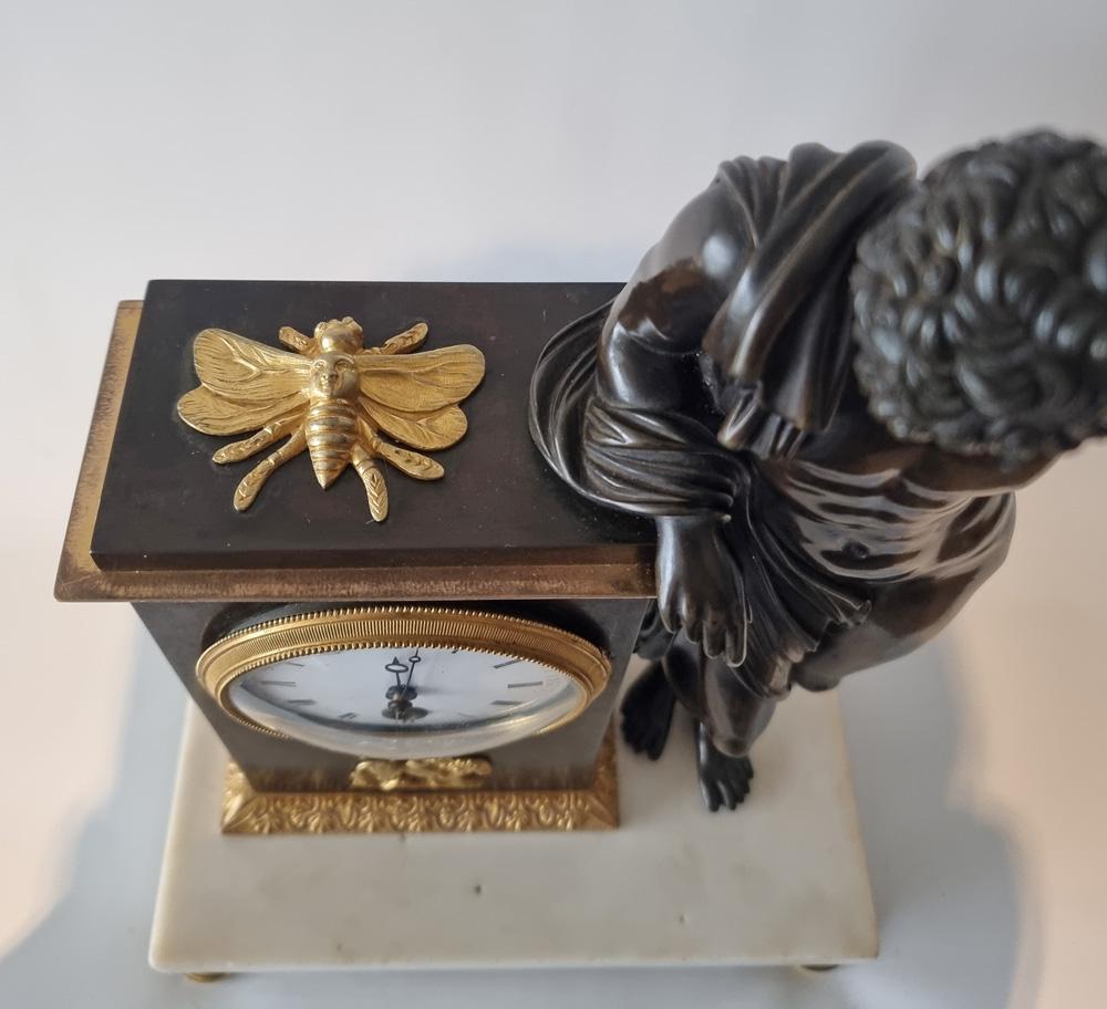 A fine English Regency mantel clock.
To one side is the figure of Aristaeus, leaning against the clock housing. Aristaeus, the son of the Gods Apollo and Cyrene, and was the God and patron of many rural arts and was the mythological culture hero