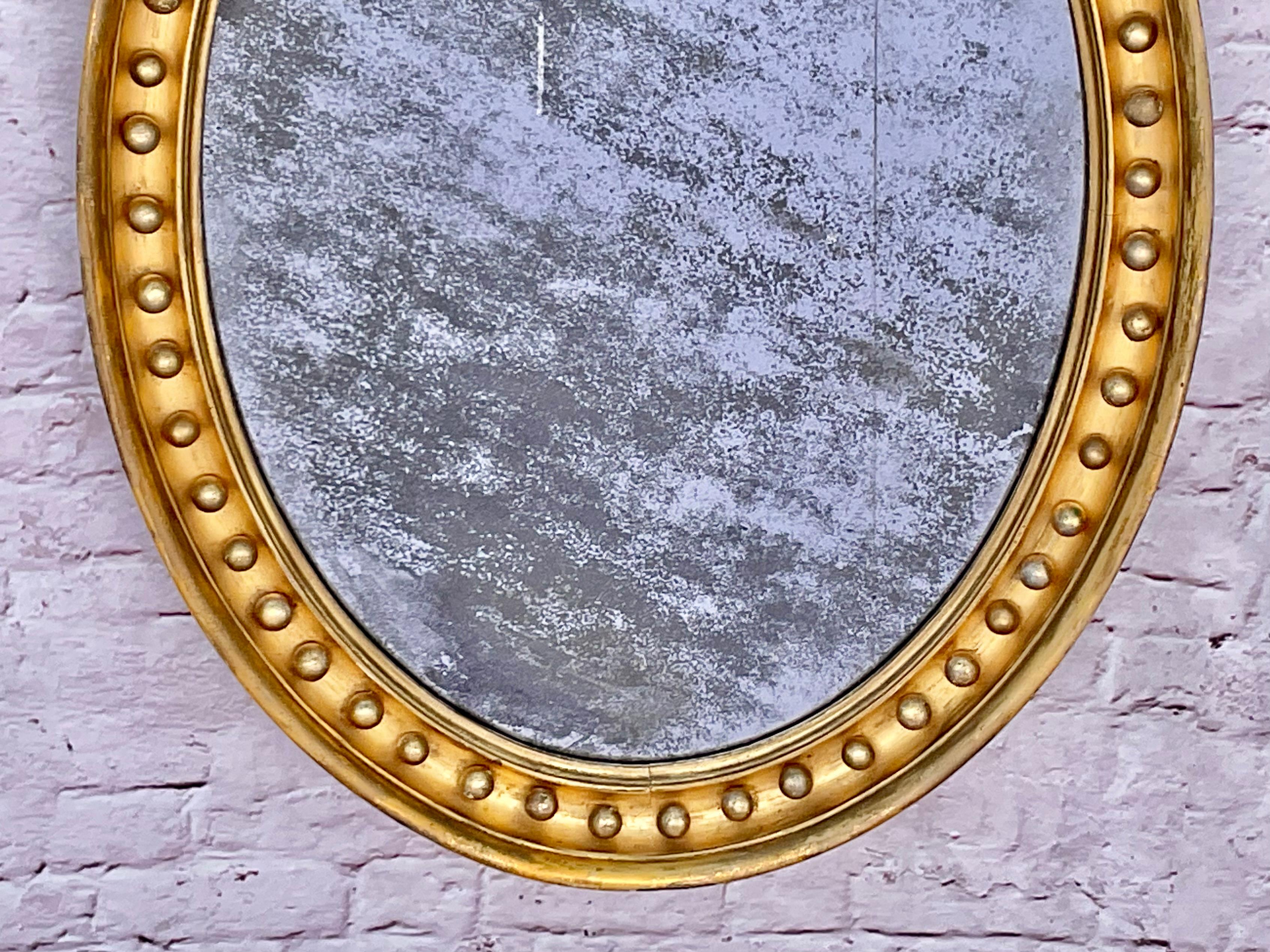 XIXe siècle Miroir ovale en bois doré de style Régence anglaise en vente