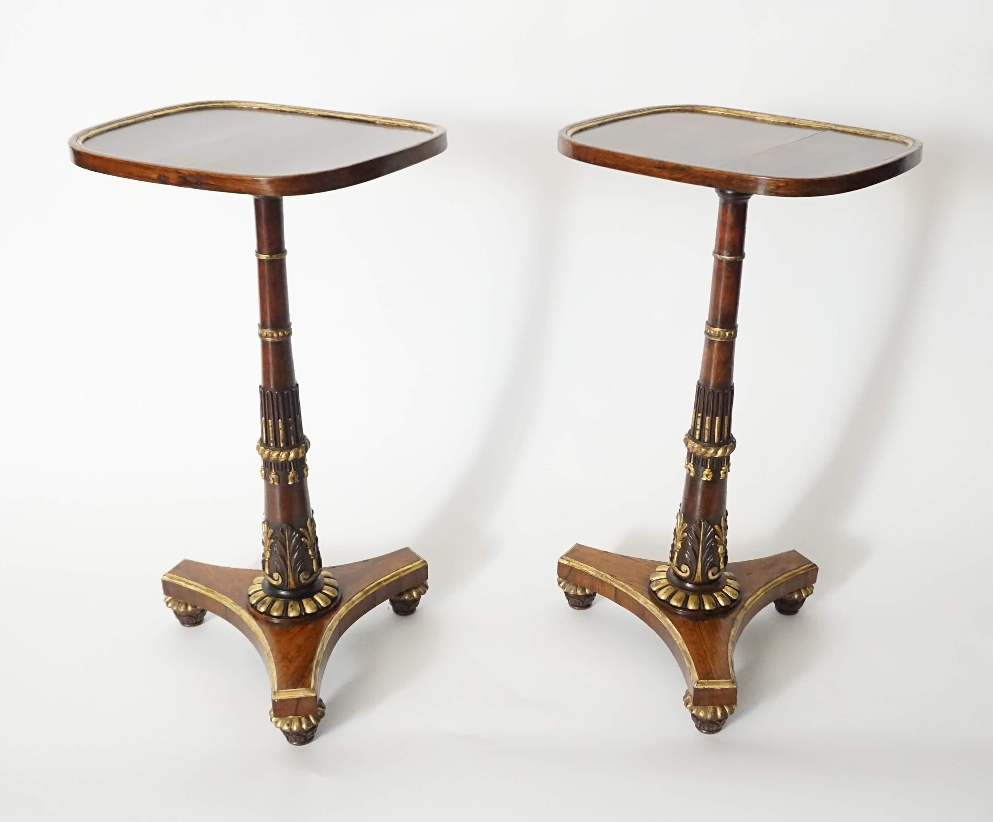 An exquisite and extremely rare pair of English Regency, circa 1828, parcel-gilt and carved rosewood side tables firmly attributed to renowned London firm Morel & Seddon, the rounded rectangular tops with gilt inner-band on carved and gilt pedestals
