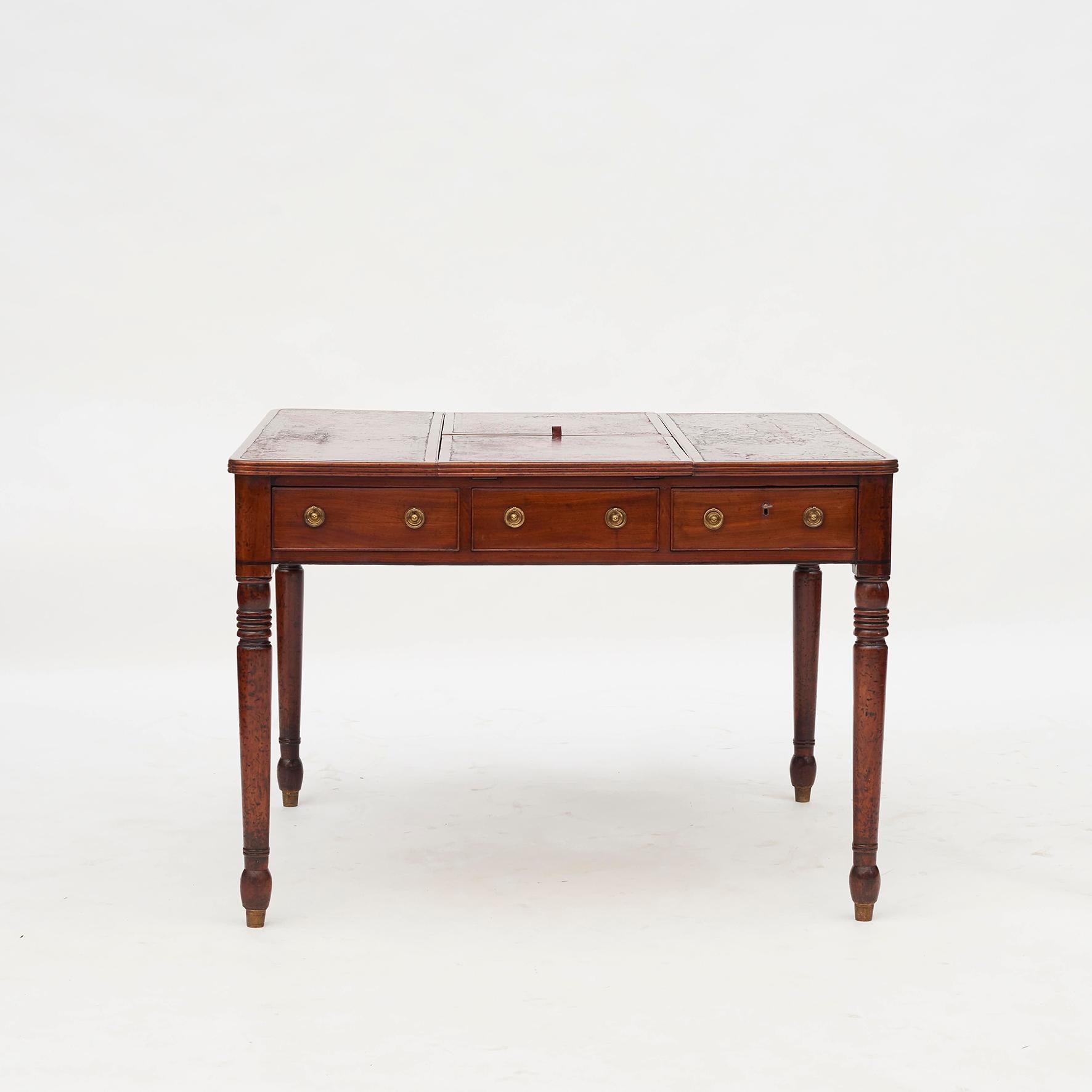 Elegant 'Lady' partners desk in mahogany. Drawers on both sides. One lockable drawer with key. Pair of lifting writing surfaces. The two writing surfaces on each side can be raised or lowered (tilted) as required for comfort when you are working.