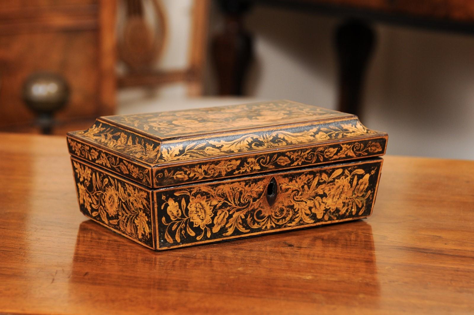 Early 19th century English Regency penwork box featuring two ladies sitting at leisure and stylized foliage design throughout. The interior lined with paper.

 
