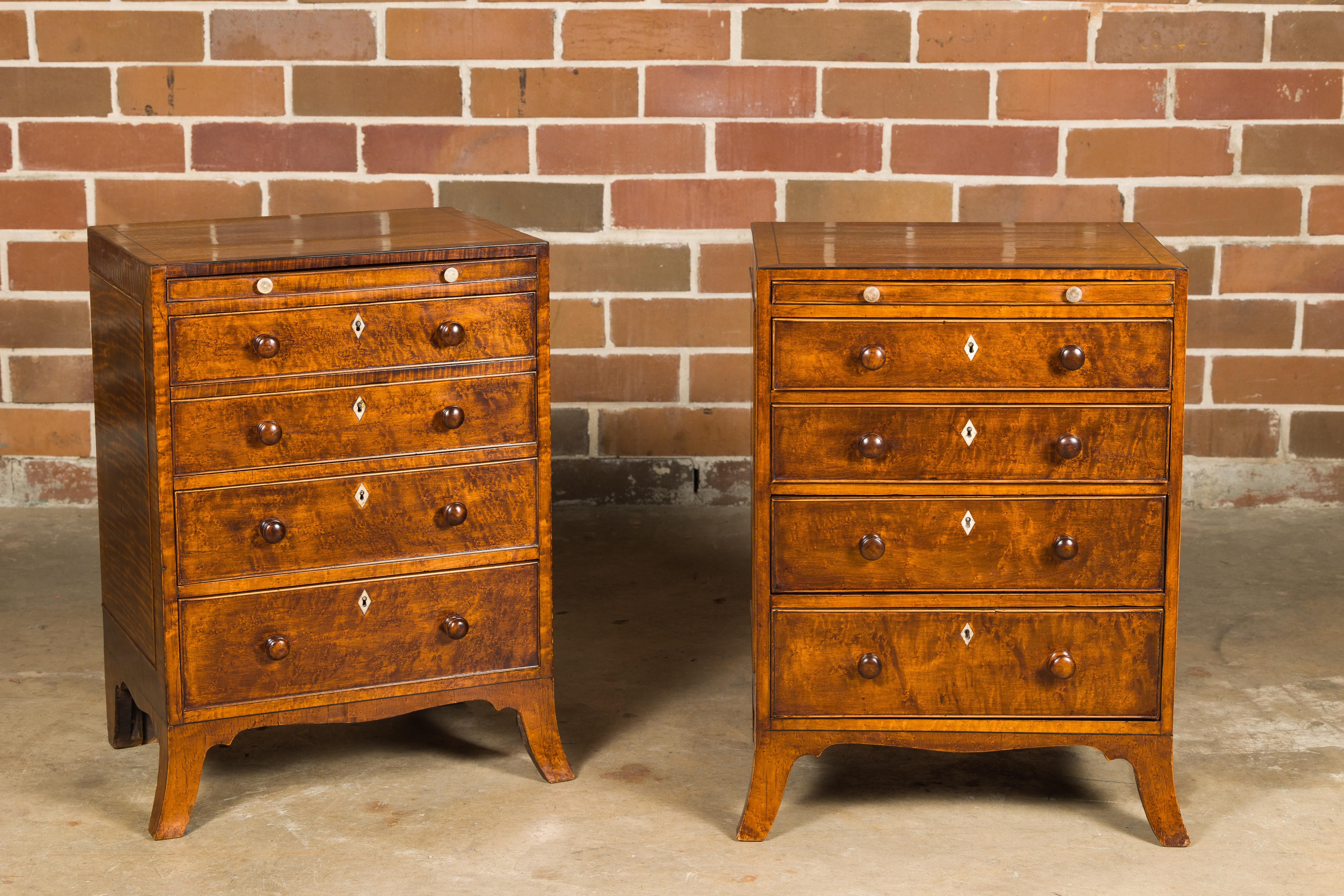 A pair of English Regency period bedside chests from circa 1820 with graduating drawers. These exquisite English Regency period bedside chests, dating back to around 1820, are a testament to the elegance and craftsmanship of their era. Crafted with