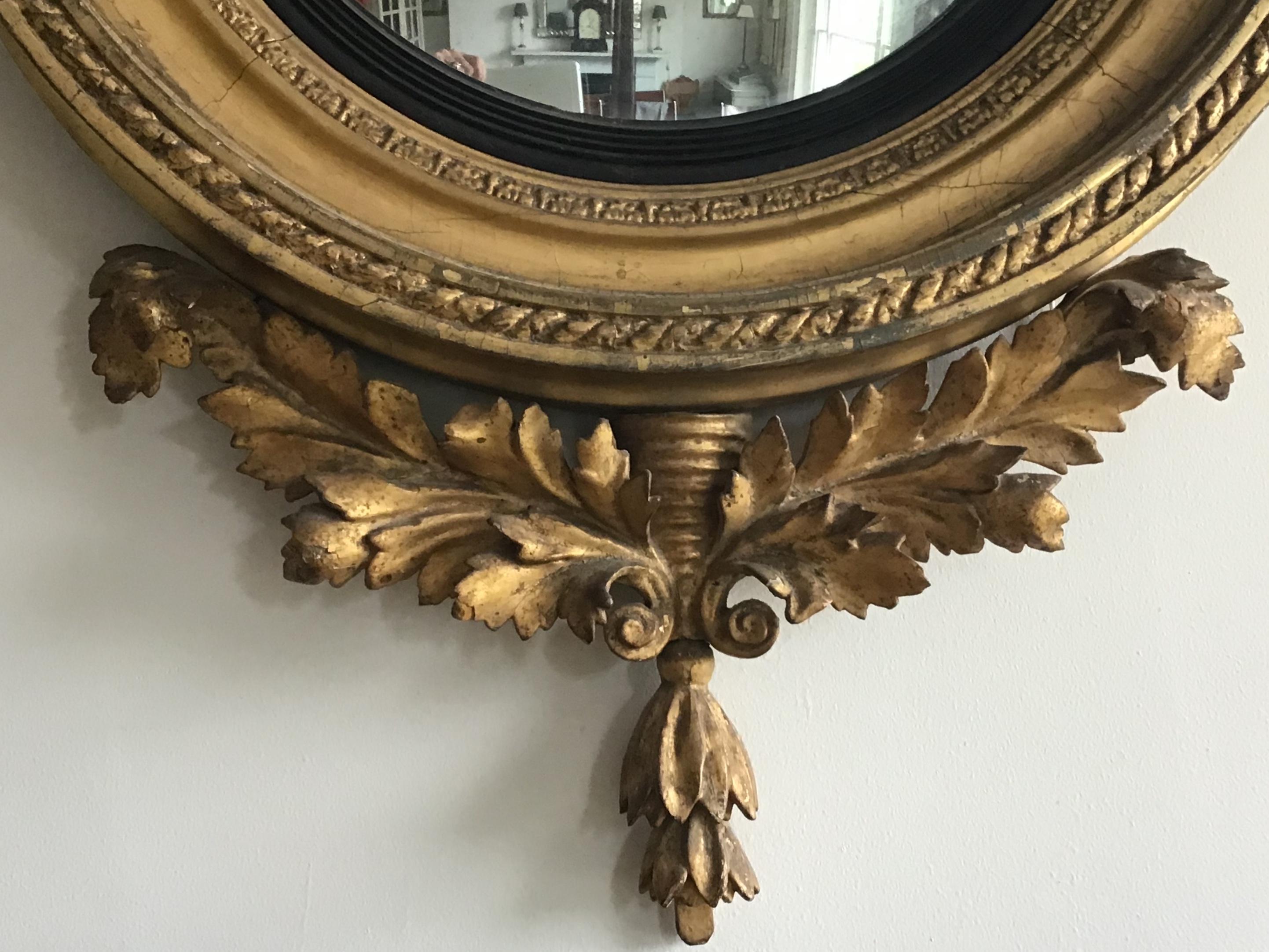 Carved English Regency Period Giltwood Convex Wall Mirror with Eagle Crest For Sale