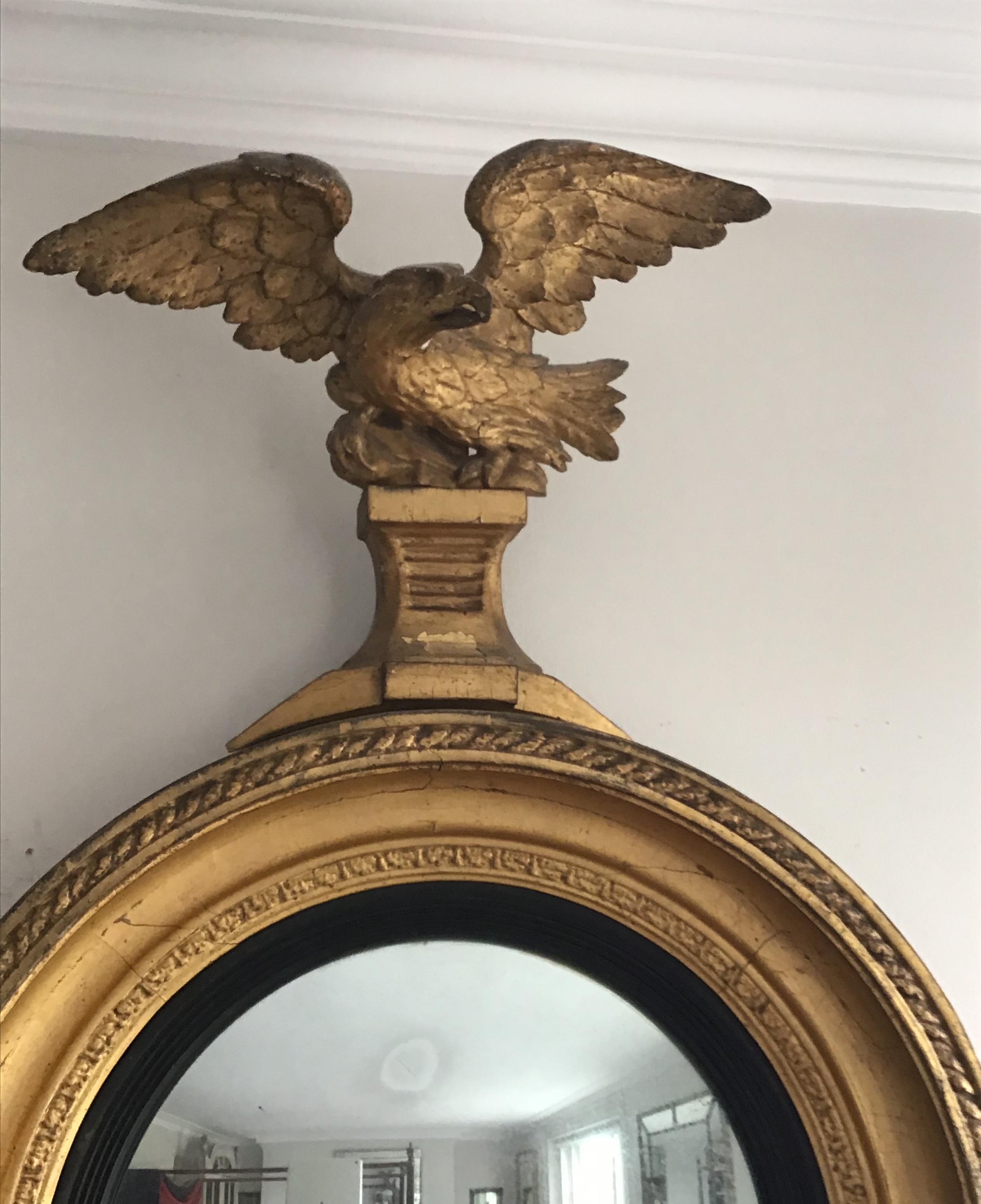 19th Century English Regency Period Giltwood Convex Wall Mirror with Eagle Crest For Sale