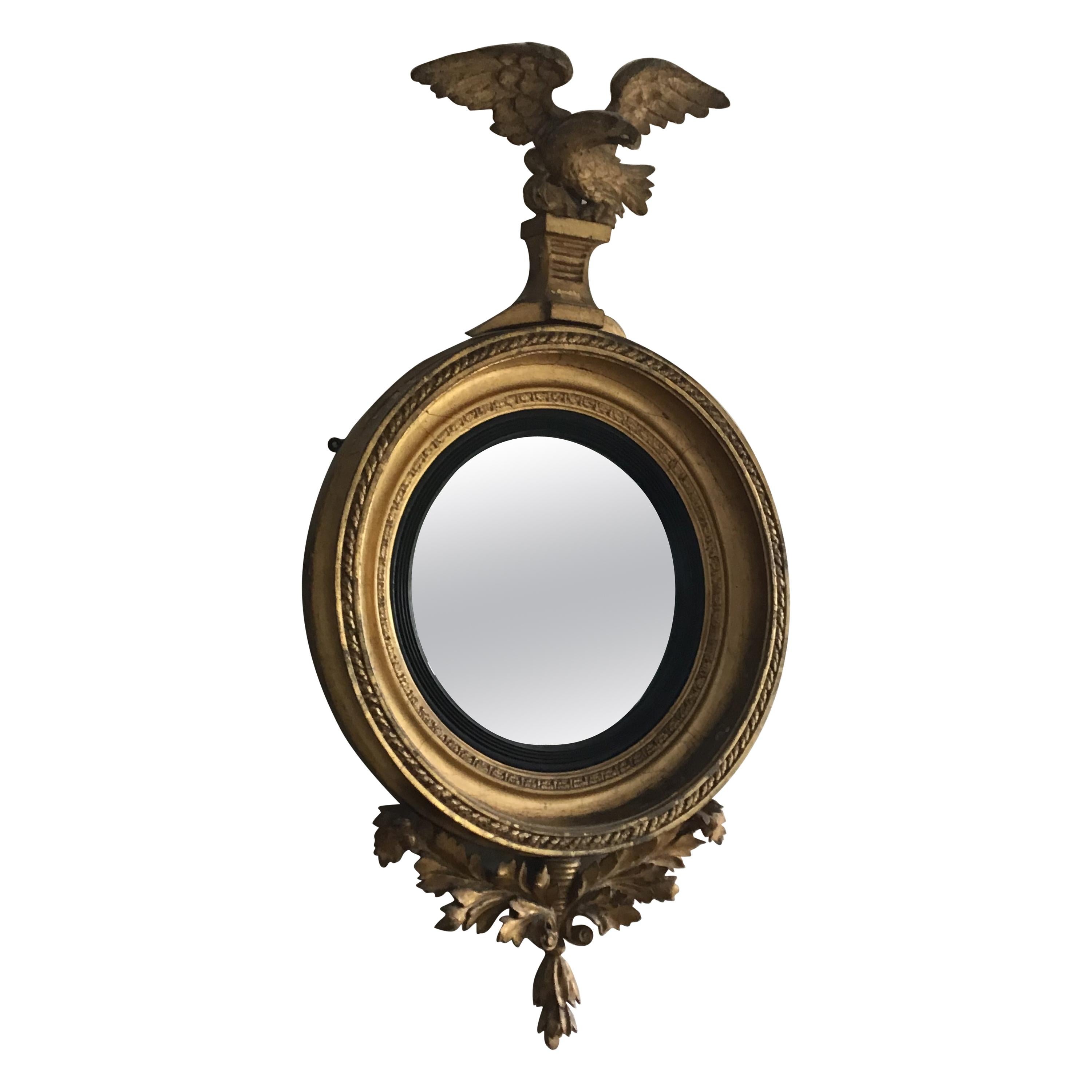 English Regency Period Giltwood Convex Wall Mirror with Eagle Crest For Sale