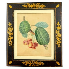 Estampe représentant des cerisiers, peinte à l'aquarelle, datant de la période de la Régence anglaise, dans un cadre laqué peint à la main