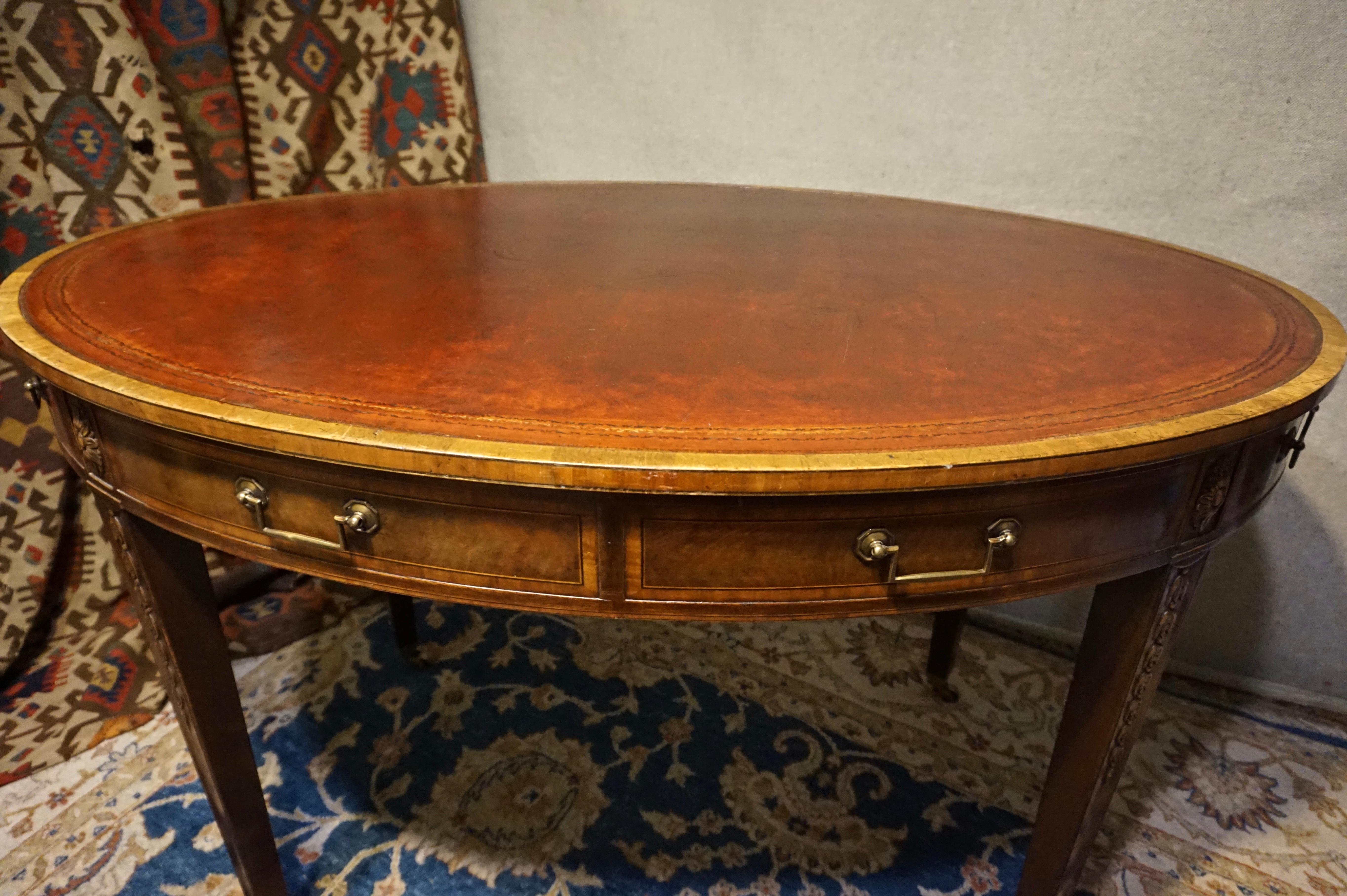 Late 19th Century English Regency Revival Mahogany Oval Table with Gilt Leather Top