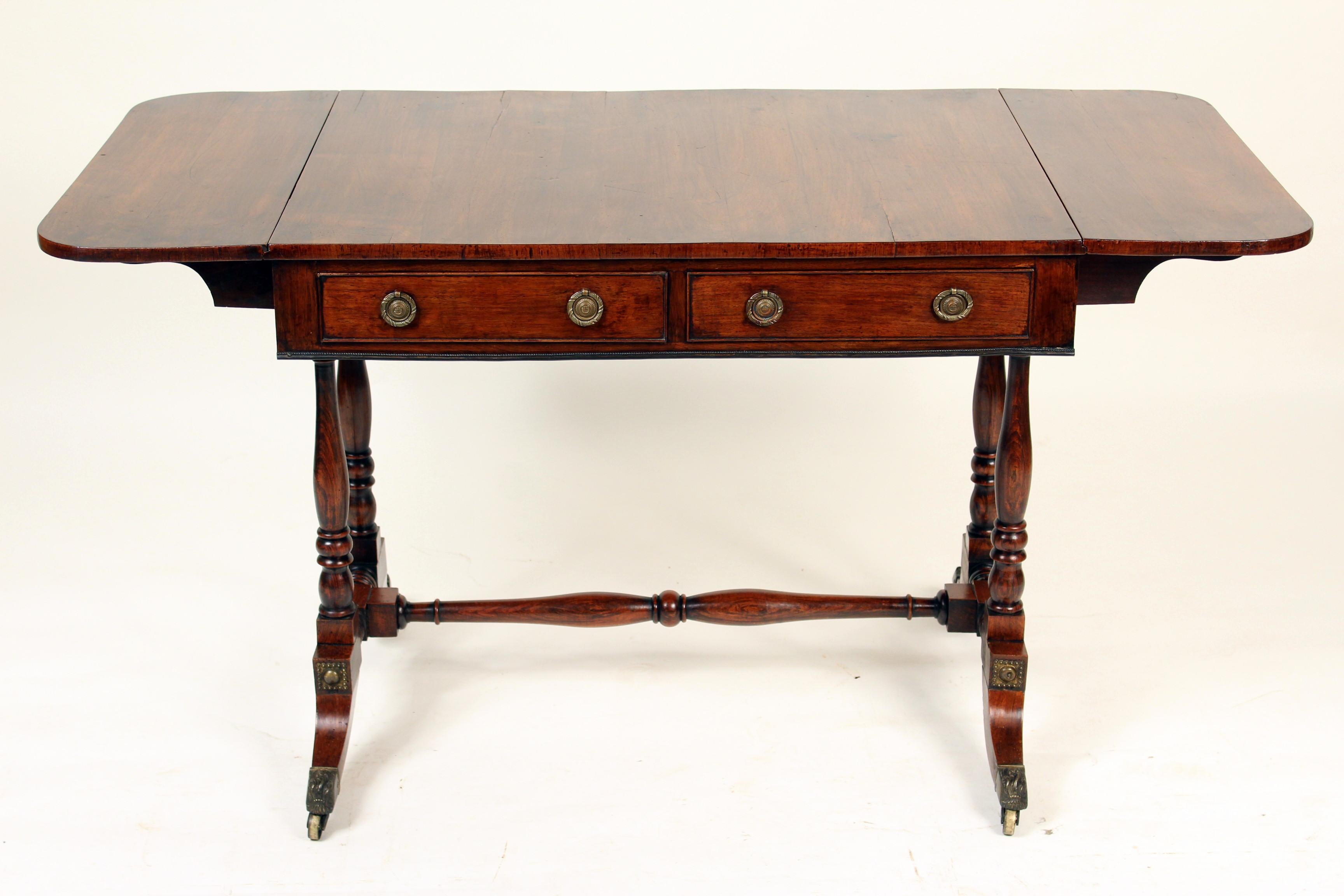 English regency rose wood sofa table, circa 1810. The width is 52.25