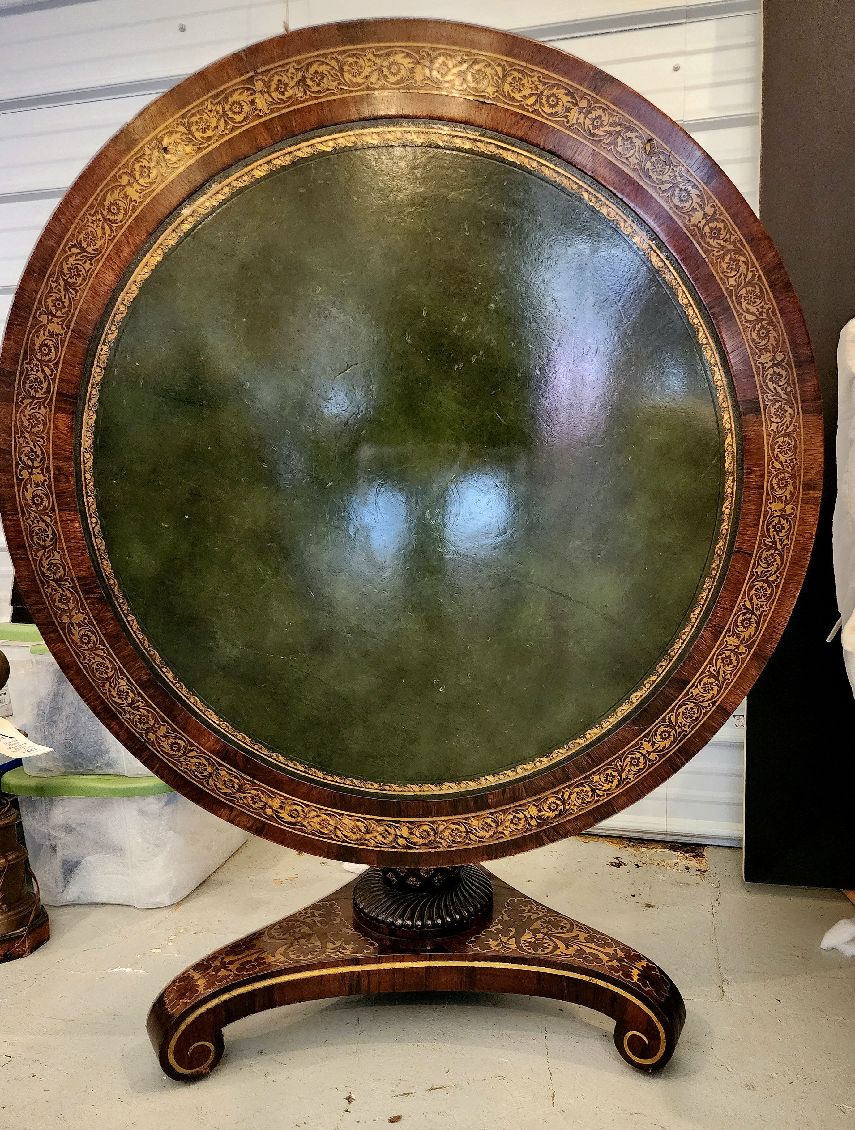 Superb early 19th century rosewood Regency table with beaded edge circular tilt-top.  the top is hinged upon a highly unusual carved lattice work covered pineapple standard and gilded bronze rosette insets resting on a dragoon-carved lower section