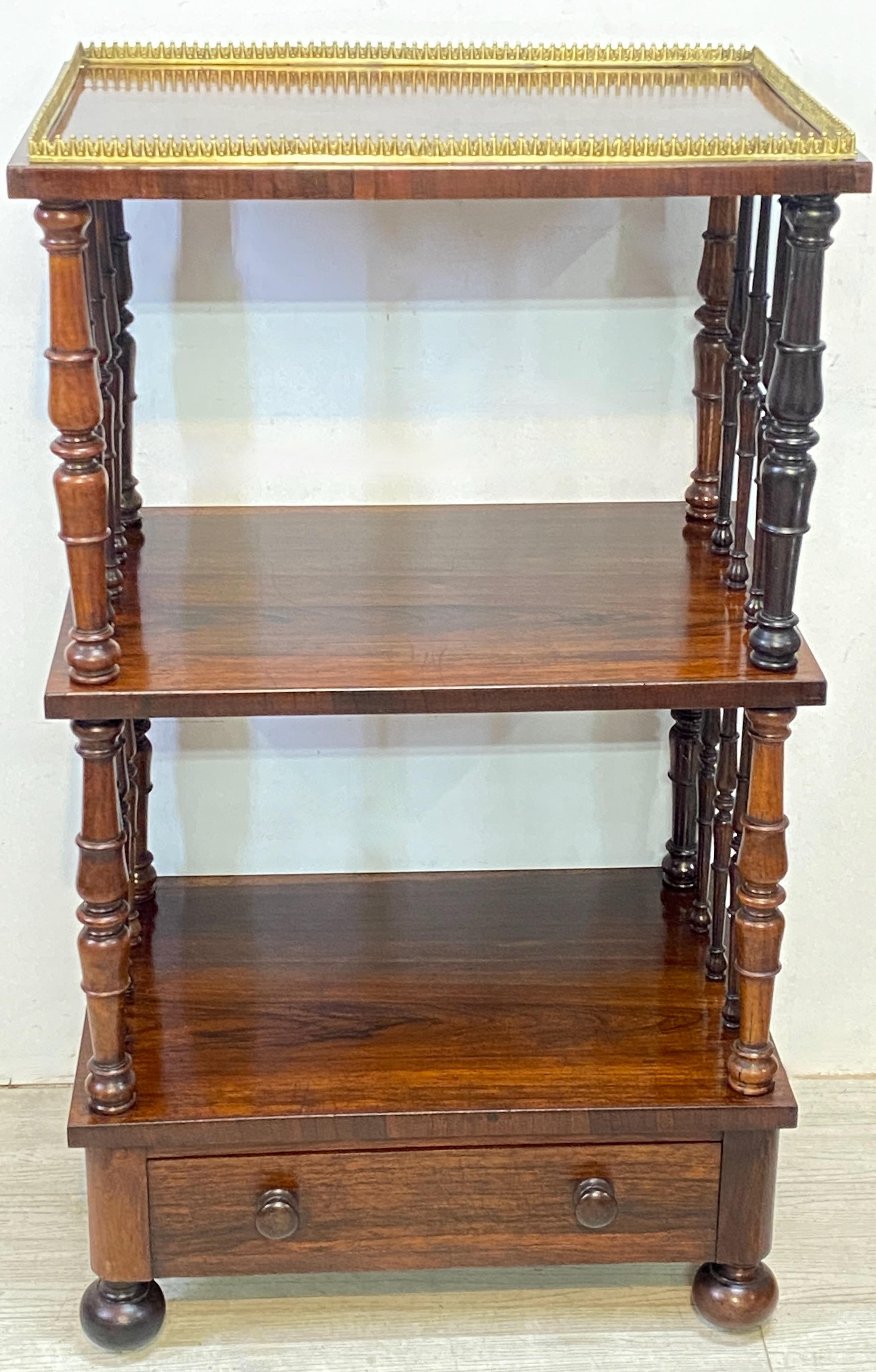 English Regency period rosewood and walnut silent butler serving table with shelves, a brass gallery around the top, and a single drawer.
Retains old if not original finish.
In beautiful antique condition.
England, circa 1830.


