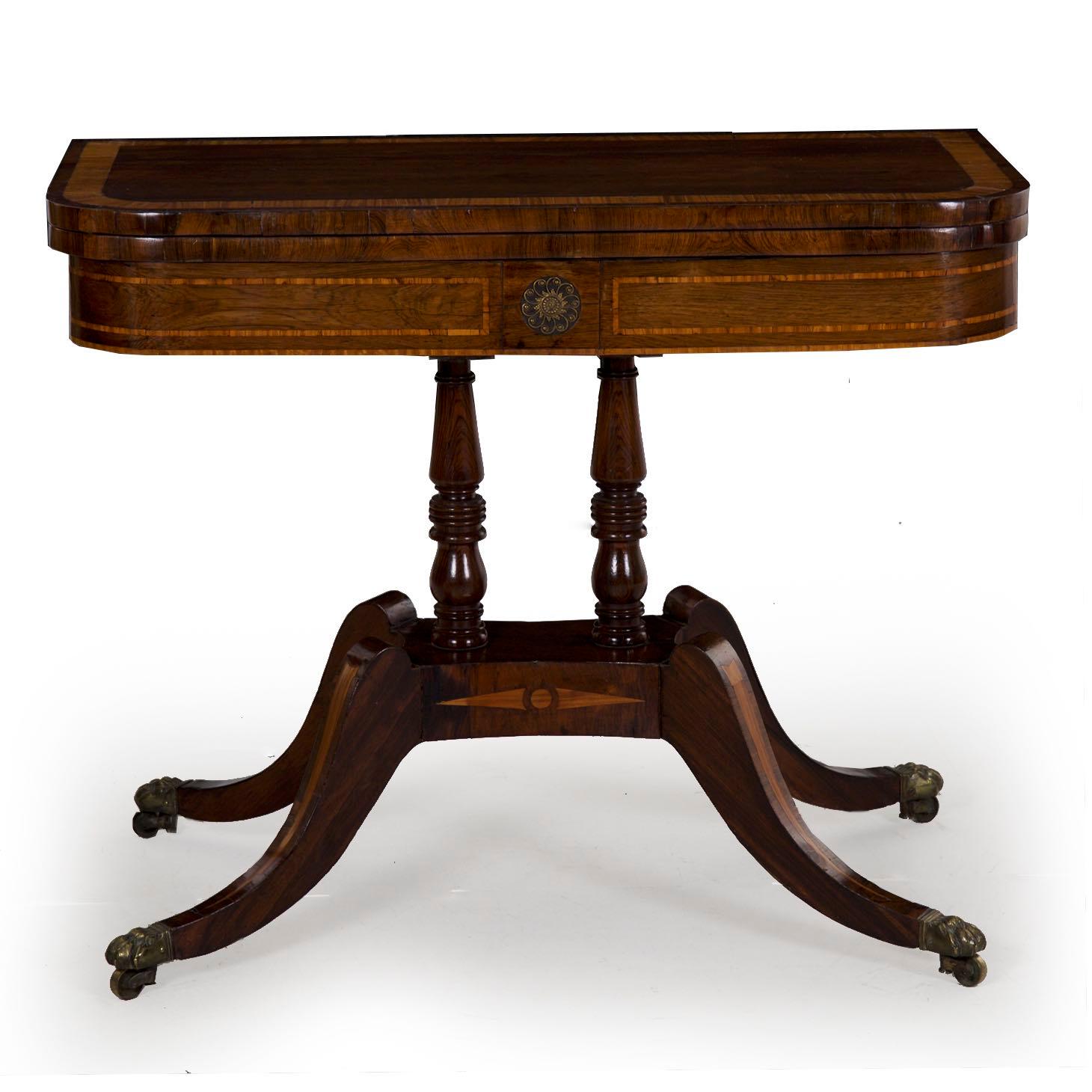 The careful use of the precious and now mostly extinct Brazilian Rosewood throughout all surfaces was a risky approach for the craftsman of this table, as the wood is fragile and difficult to work into curves. It is also exceedingly difficult to