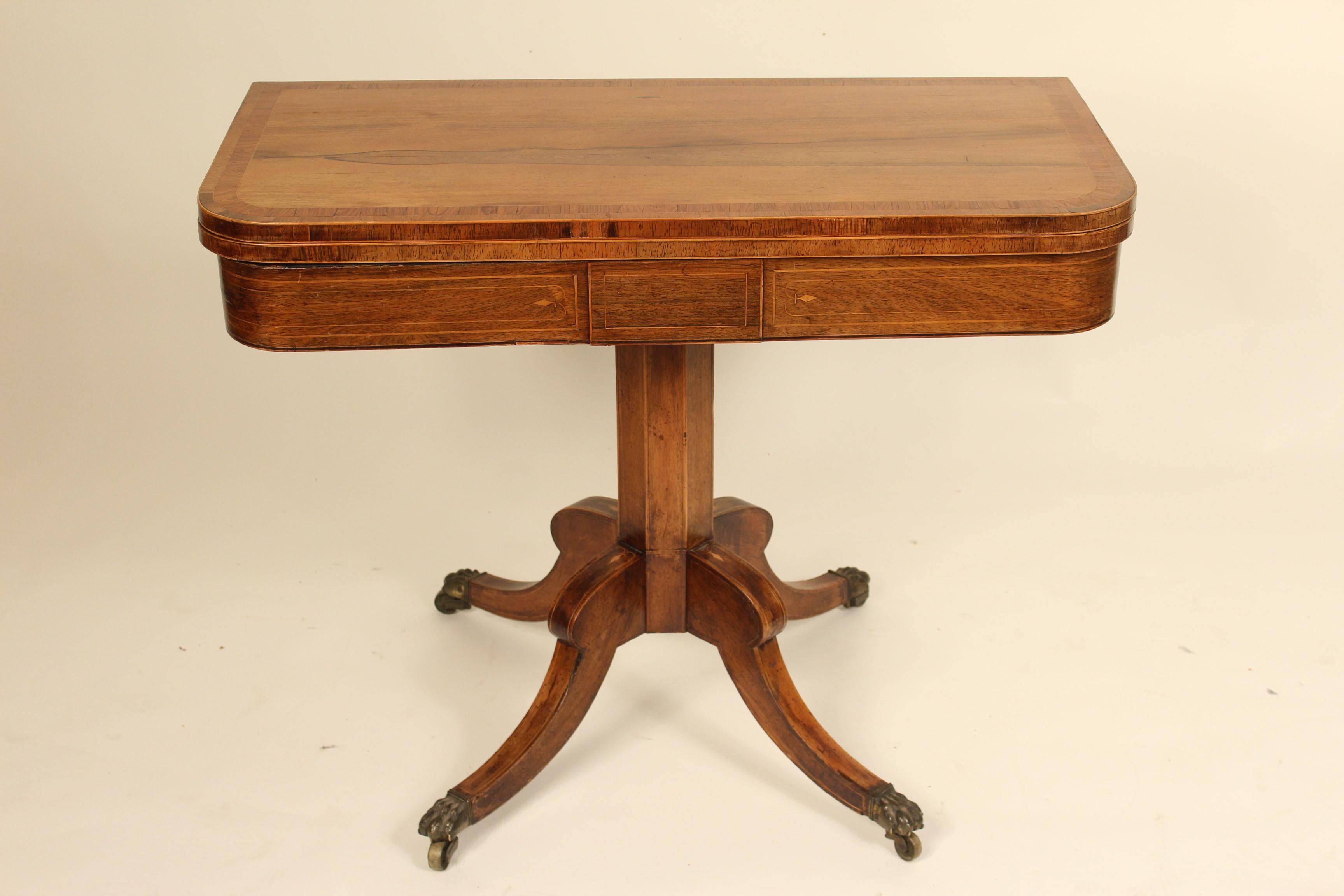 English Regency D-shaped rosewood games table, early 19th century. The depth of the top is 17.5