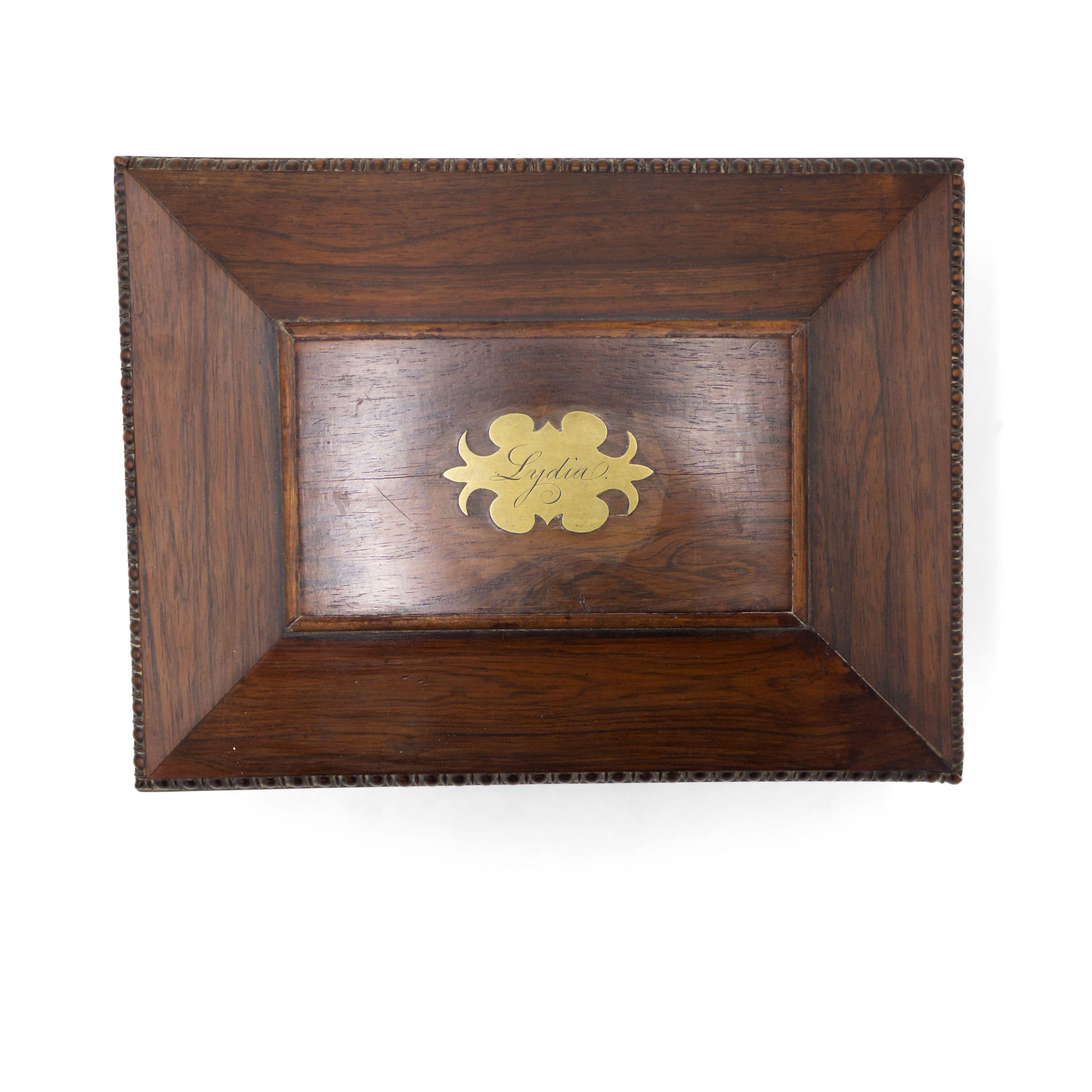 English Regency rosewood letter box in casket form on brass feet with ring handles and a brass plaque engraved with name 