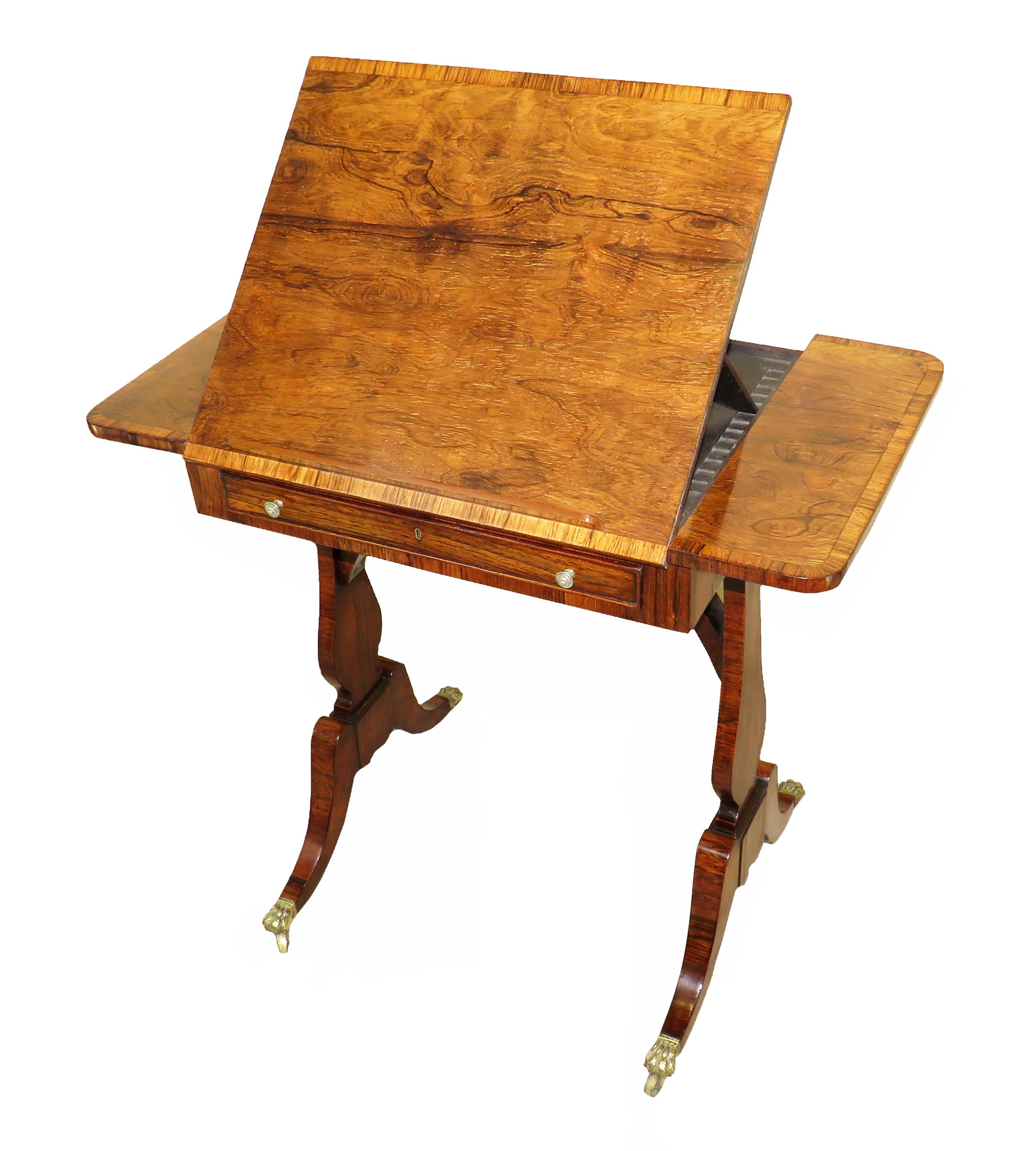 A charming and very fine quality regency period rosewood
Reading, or lamp, table having superbly figured oblong top with cross
Banded decoration and ratcheted centre section over one
Frieze drawer to front and false drawer to reverse raised