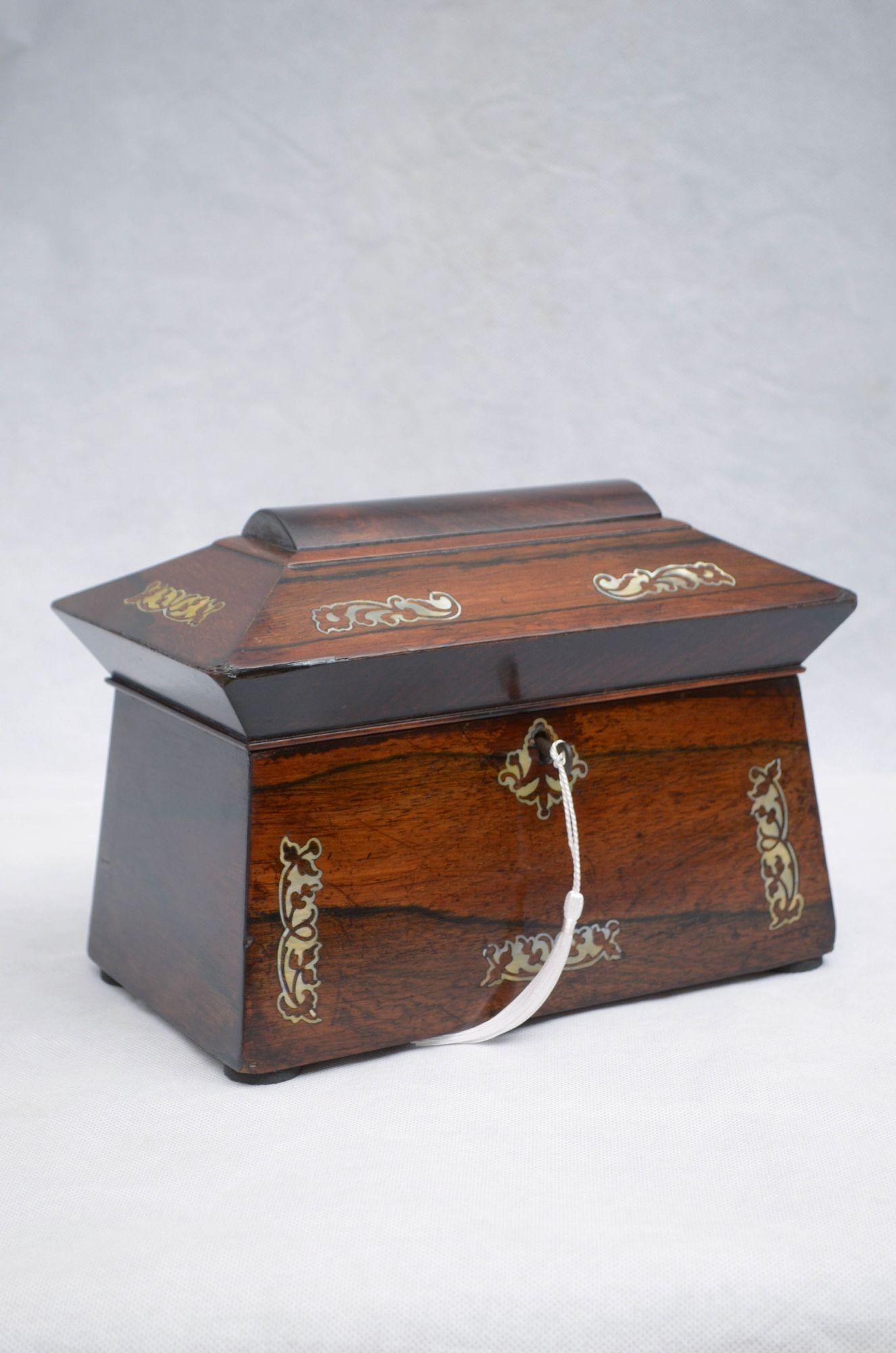 P0241 Attractive rosewood jewellery box with mother of pearl inlays, lined interior and original working lock with a key. This antique box is in home ready condition. UK mainland delivery included. c1820
H6.5