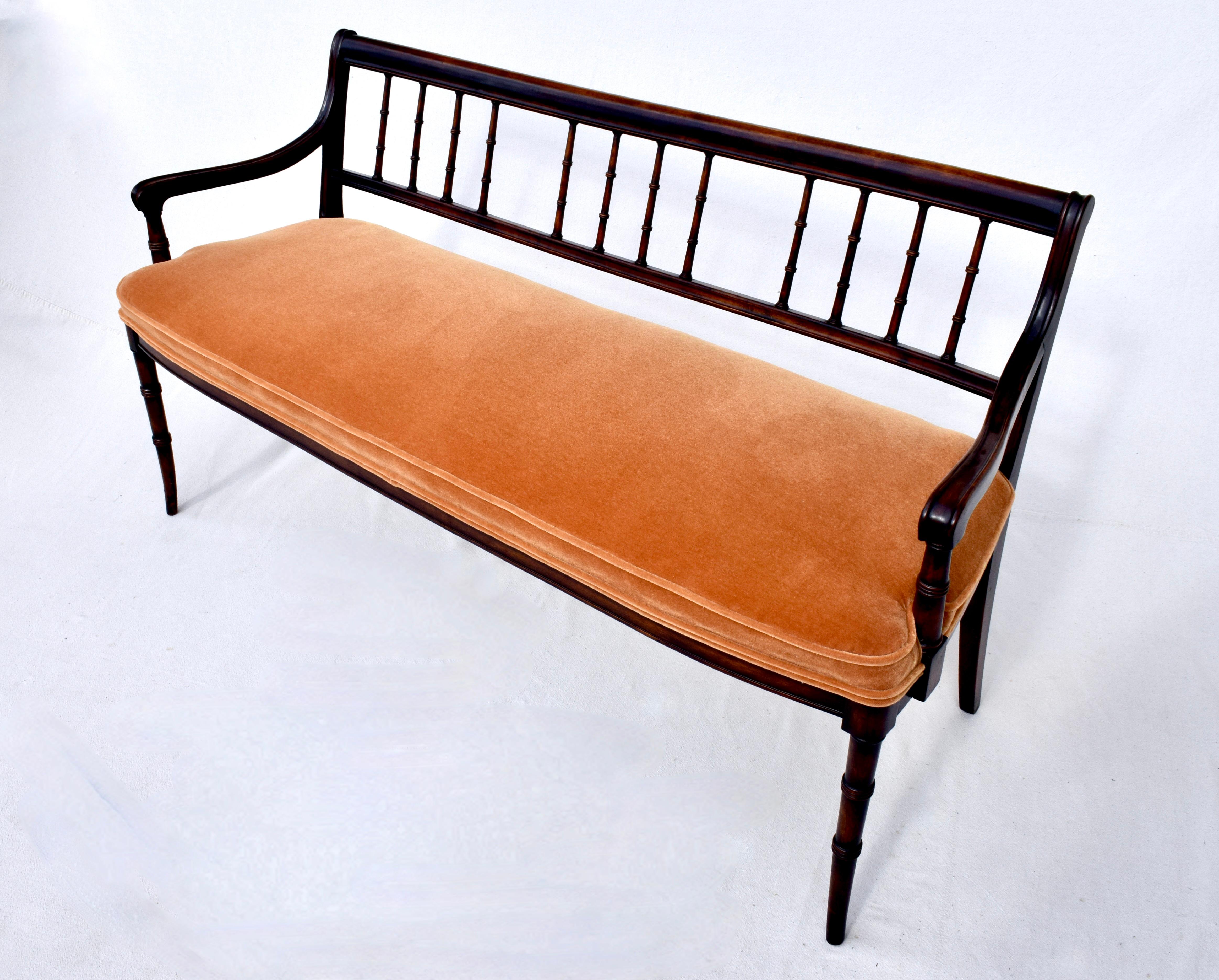 Mahogany open Regency style settee with ever so subtle curved spindle back and faux bamboo saber leg styling. Newly upholstered in plush Amber Mohair of substantial heirloom quality.
Seat 20