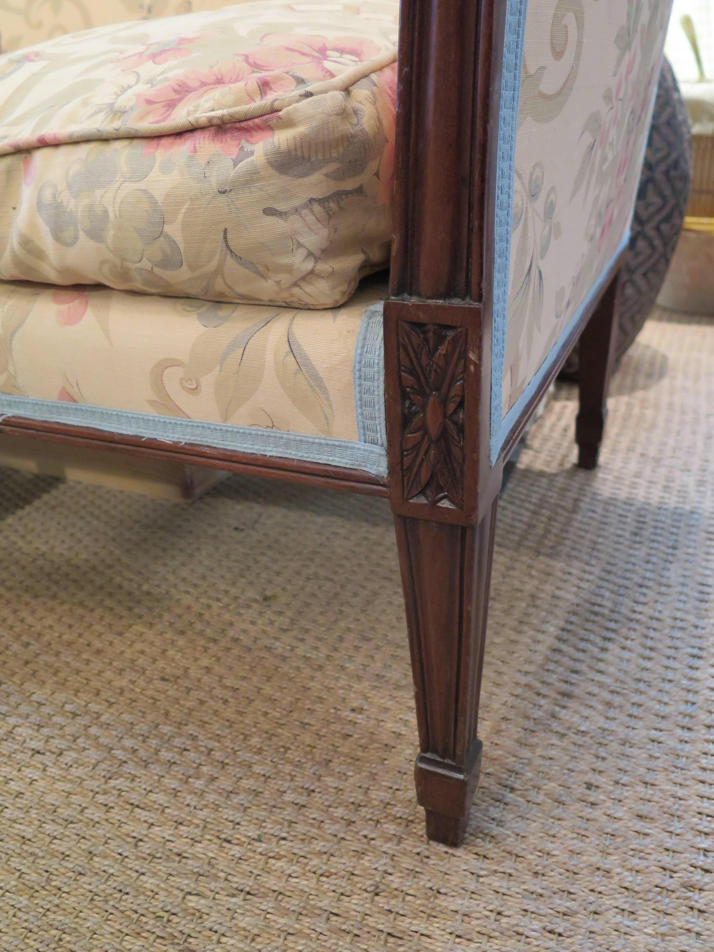 English Regency settee upholstered in George Smith Gollut fabric and accented with Classic blue trim. Measures: Seat height 18