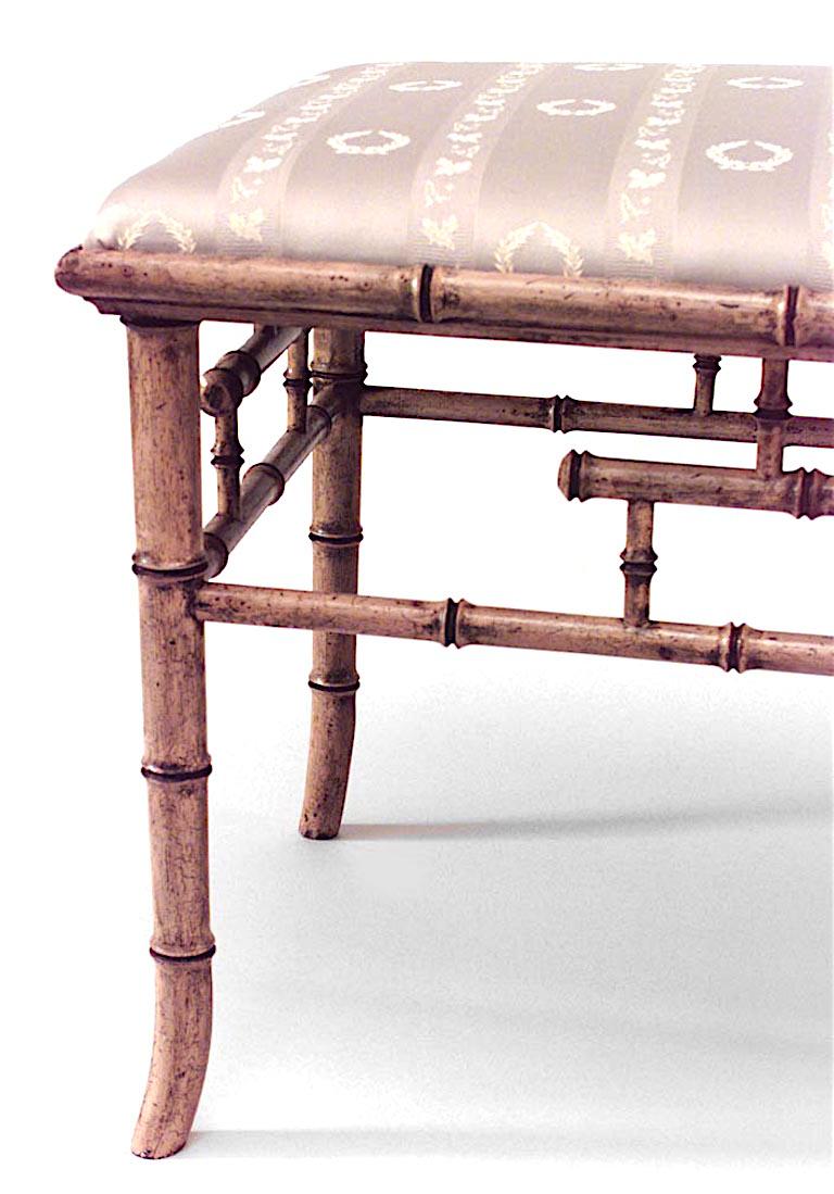 English Regency style (20th century) faux bamboo painted rectangular bench with upholstered seat.
 