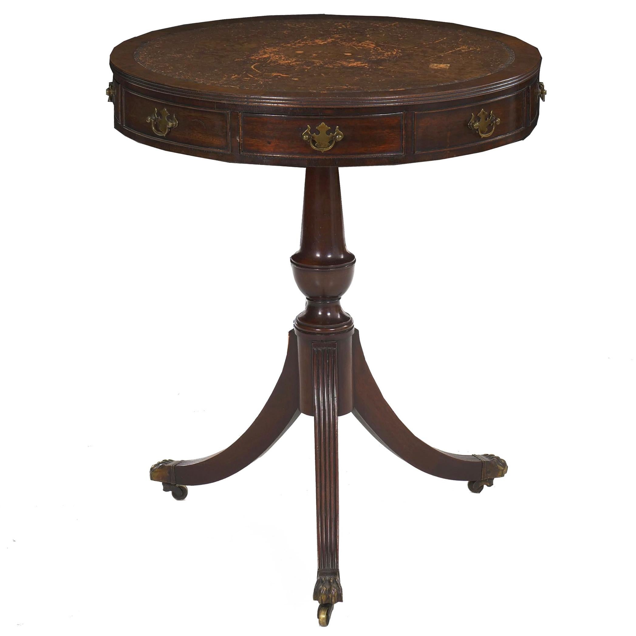 An attractive and beautifully patinated drum-top table in the Regency taste, the craftsmanship is true to the period and results in a very fine presentation. The leather is particularly nice with extensive natural wear that lends richness and warmth