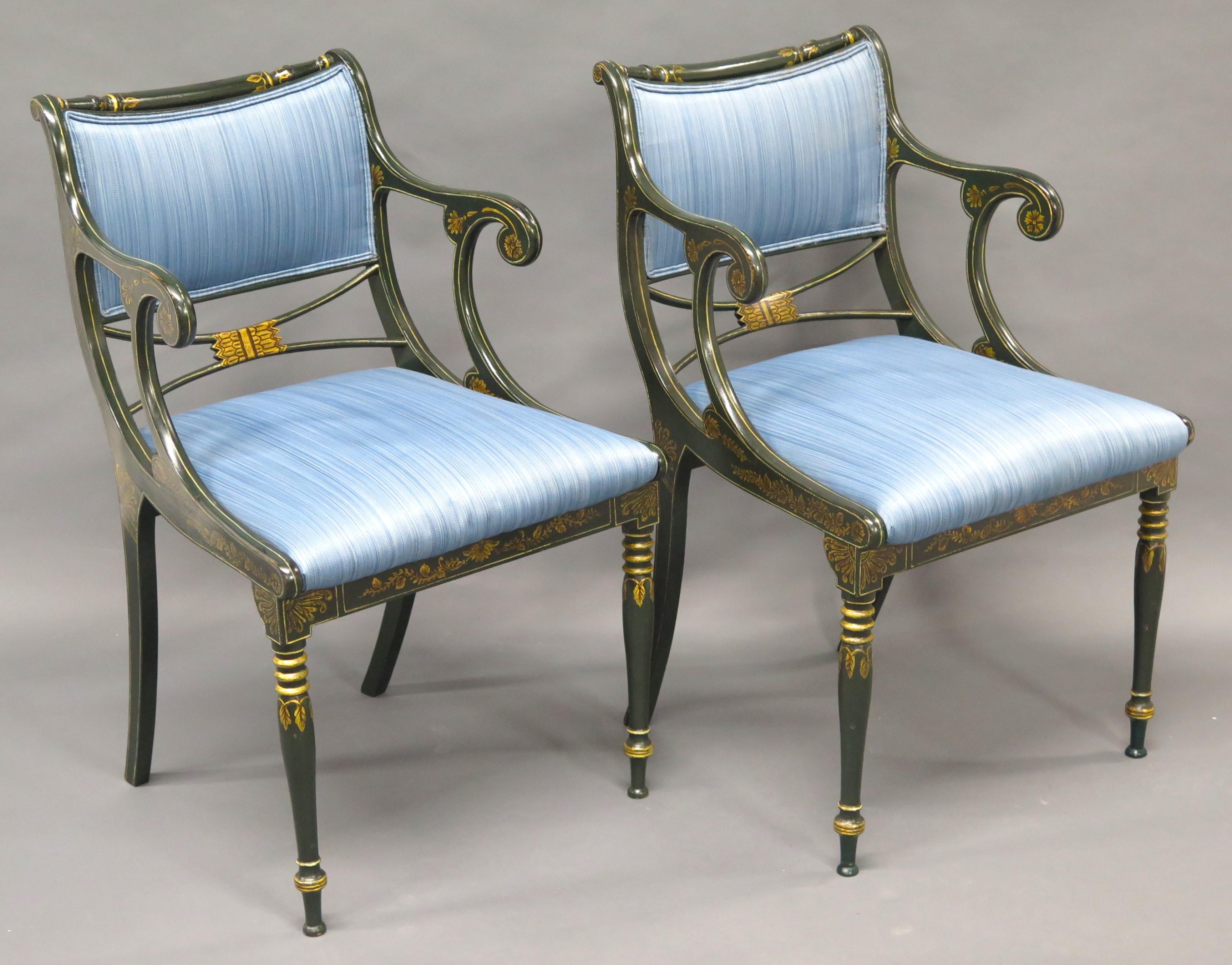English Regency style armchairs upholstered in a blue strie silk velvet, each chair has gilt stencil decoration over dark green ( almost black ) paint. England. Mid-20th Century