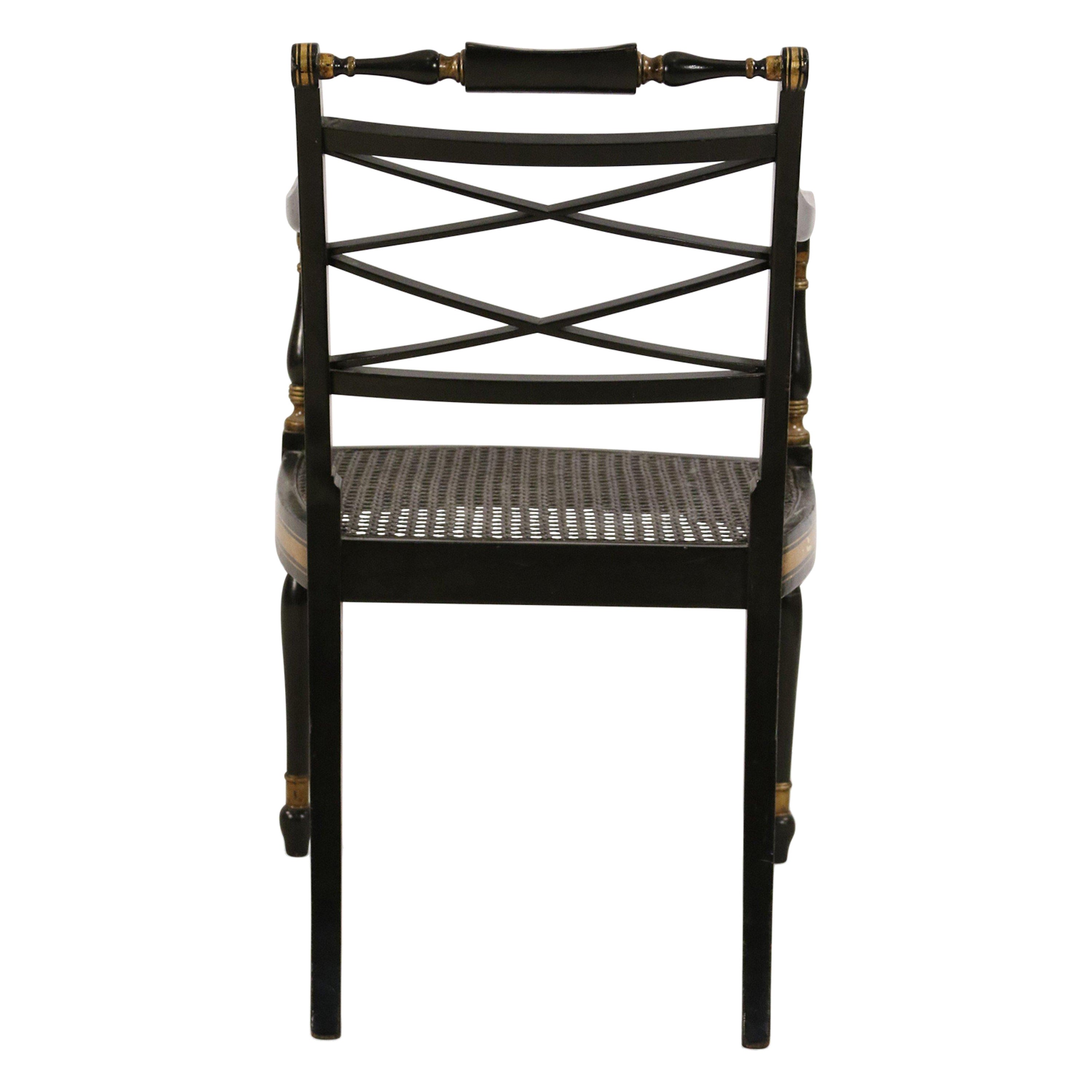 Sedia laterale con seduta in canna dipinta in oro e nero in stile Regency inglese