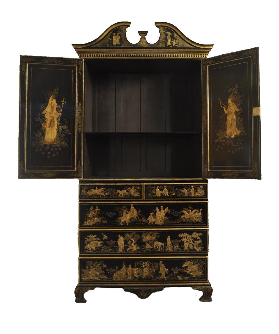English Regency style black lacquered and gold chinoiserie decorated cabinet with a base having 3 under 2 smaller drawers and a 2-door upper section having an open pediment top.