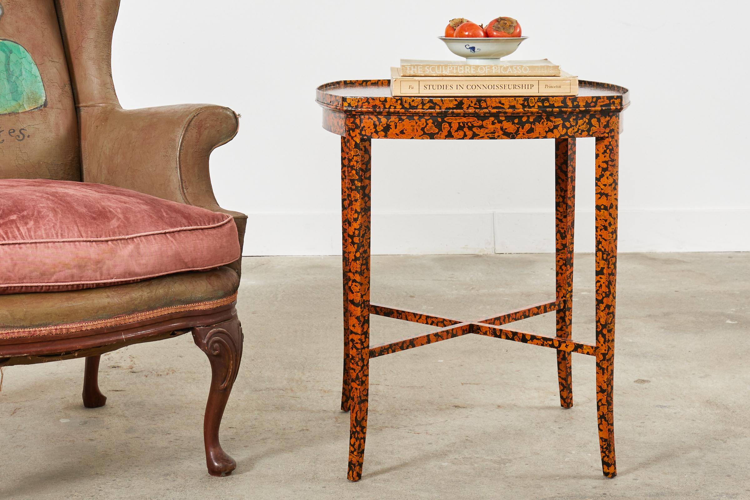 Whimsical late 19th century english center table or side table made in the regency taste. The table features a modern lacquer speckled finish by artist Ira Yeager (American 1933-2022). The table is constructed from mahogany with a square form and