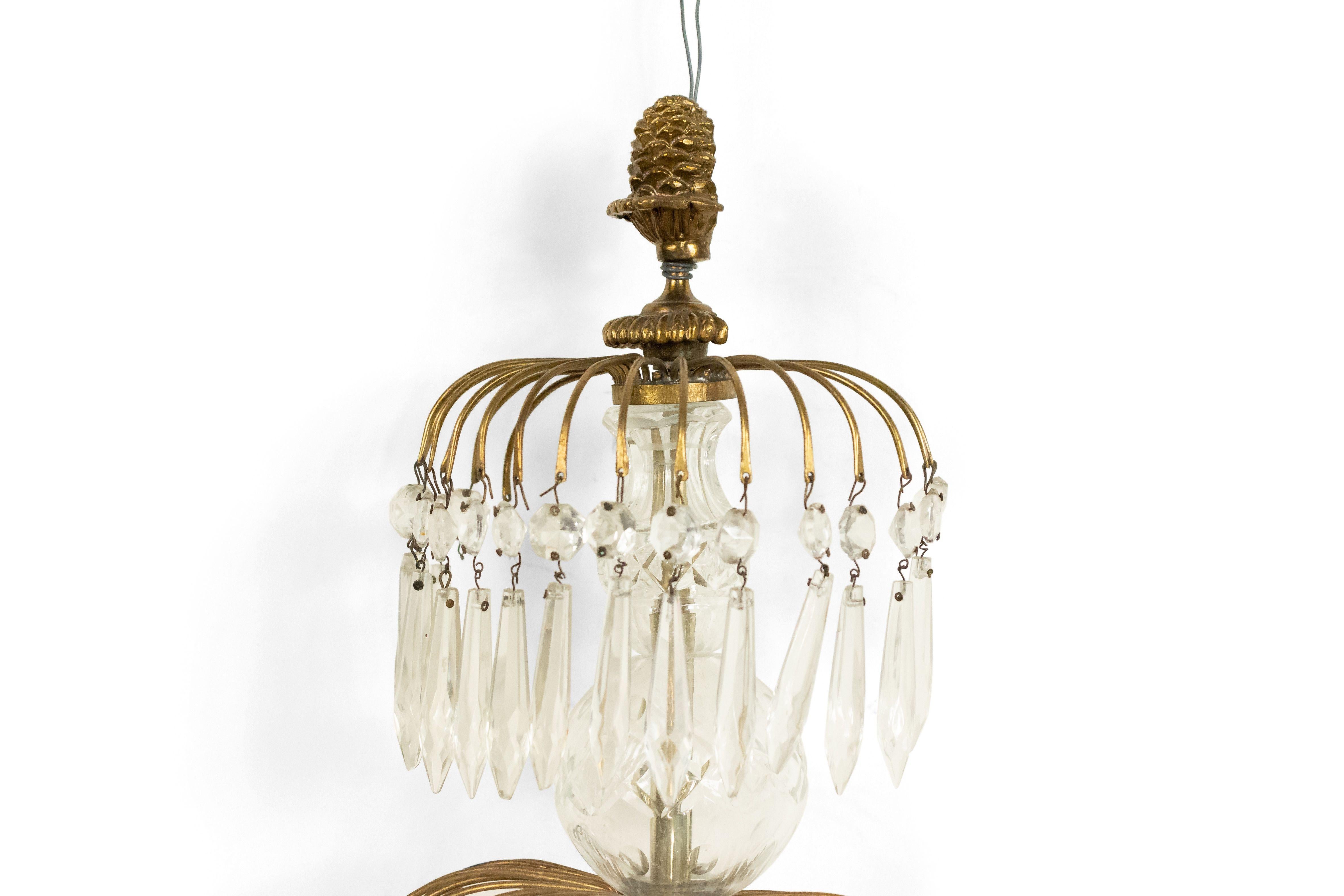 English Regency style 19th-20th century 4-tier crystal drop and brass 3-arm wall sconce.