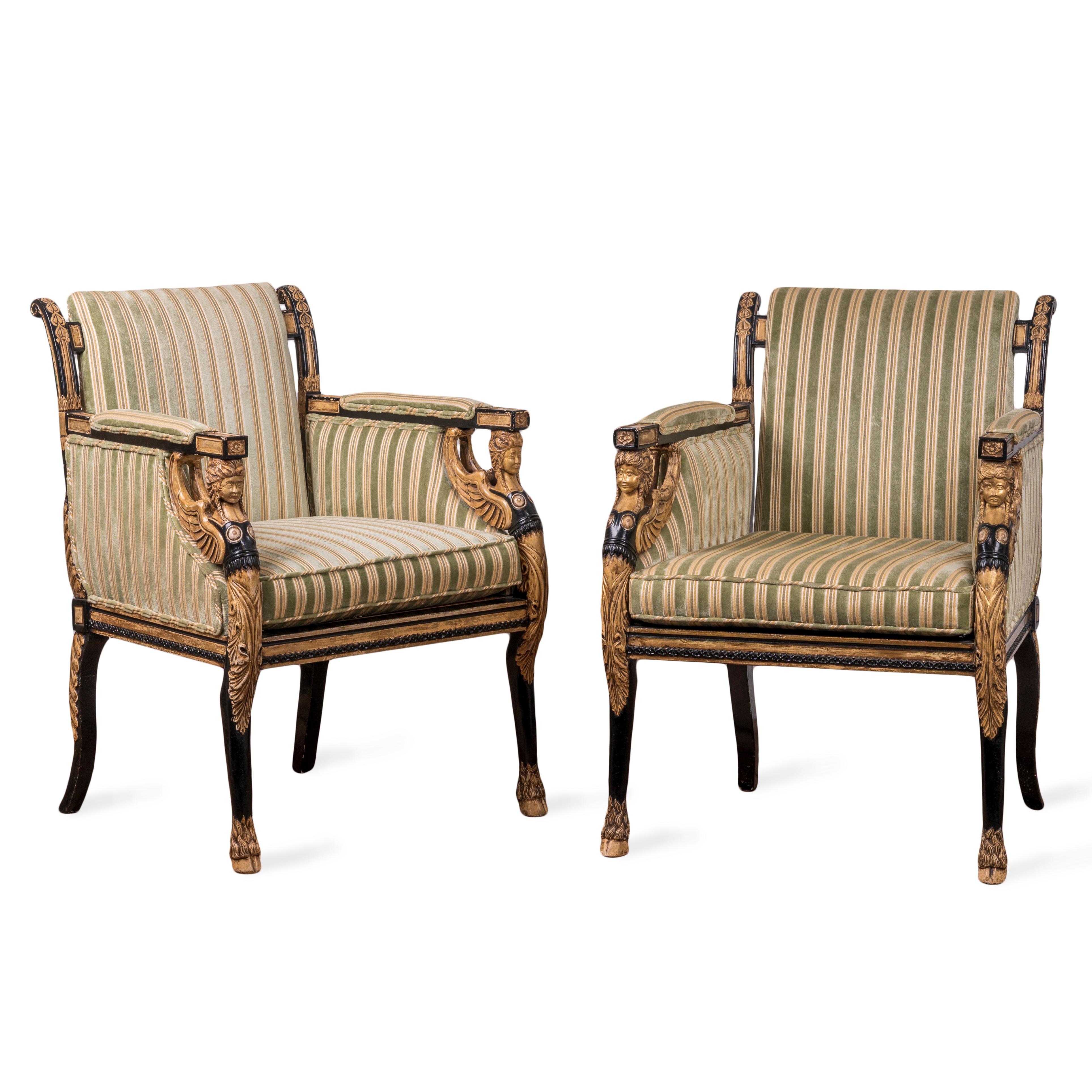 A pair of English Regency style ebonized and parcel gilt armchairs made by Burton-Ching Ltd., 20th century.

26 inches wide by 26 inches deep by 35 inches tall

seat height 19 inches; arm height 27 ½ inches 
