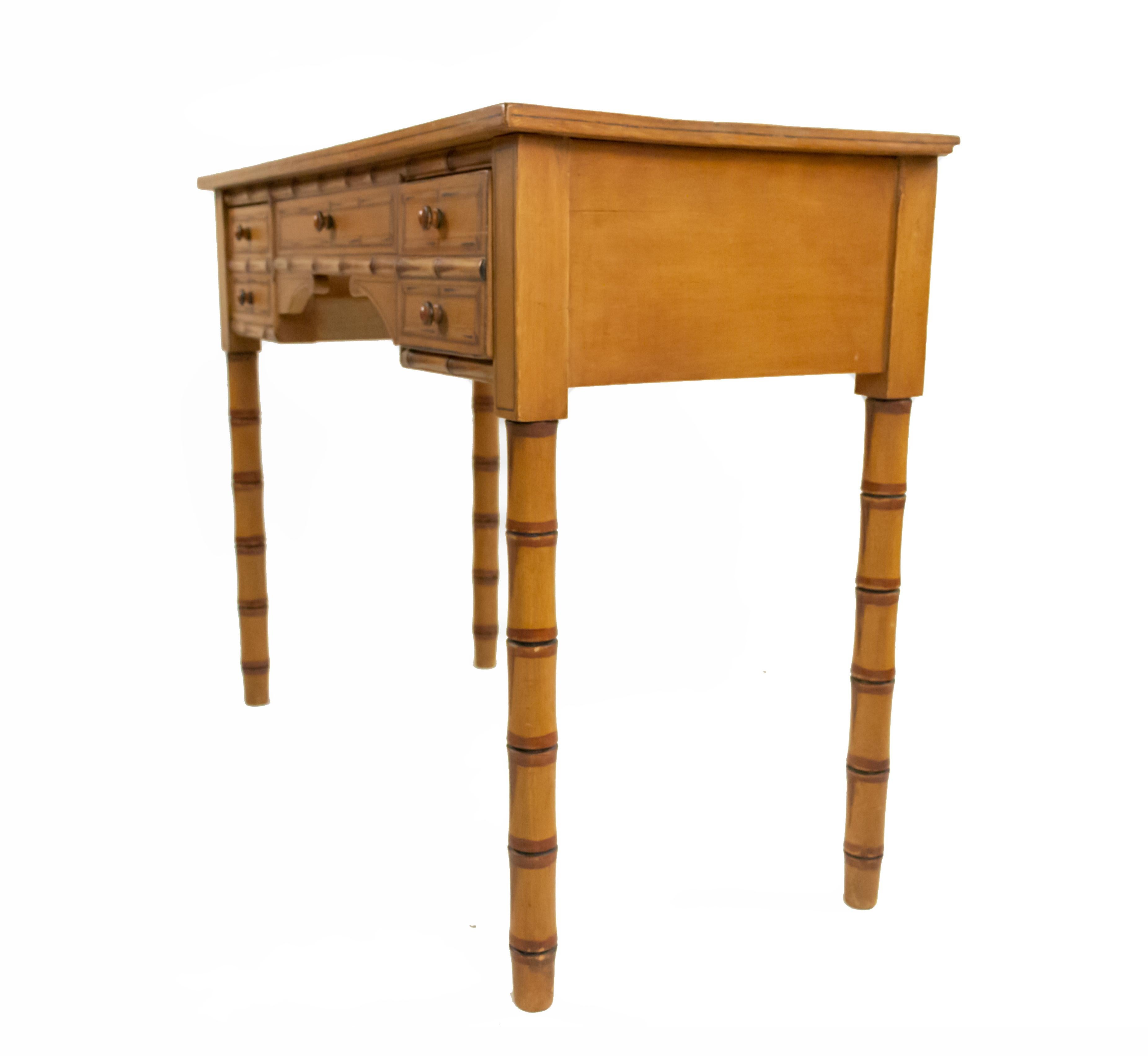 English Regency style faux bamboo painted desk with two side drawers centering a dummy drawer.