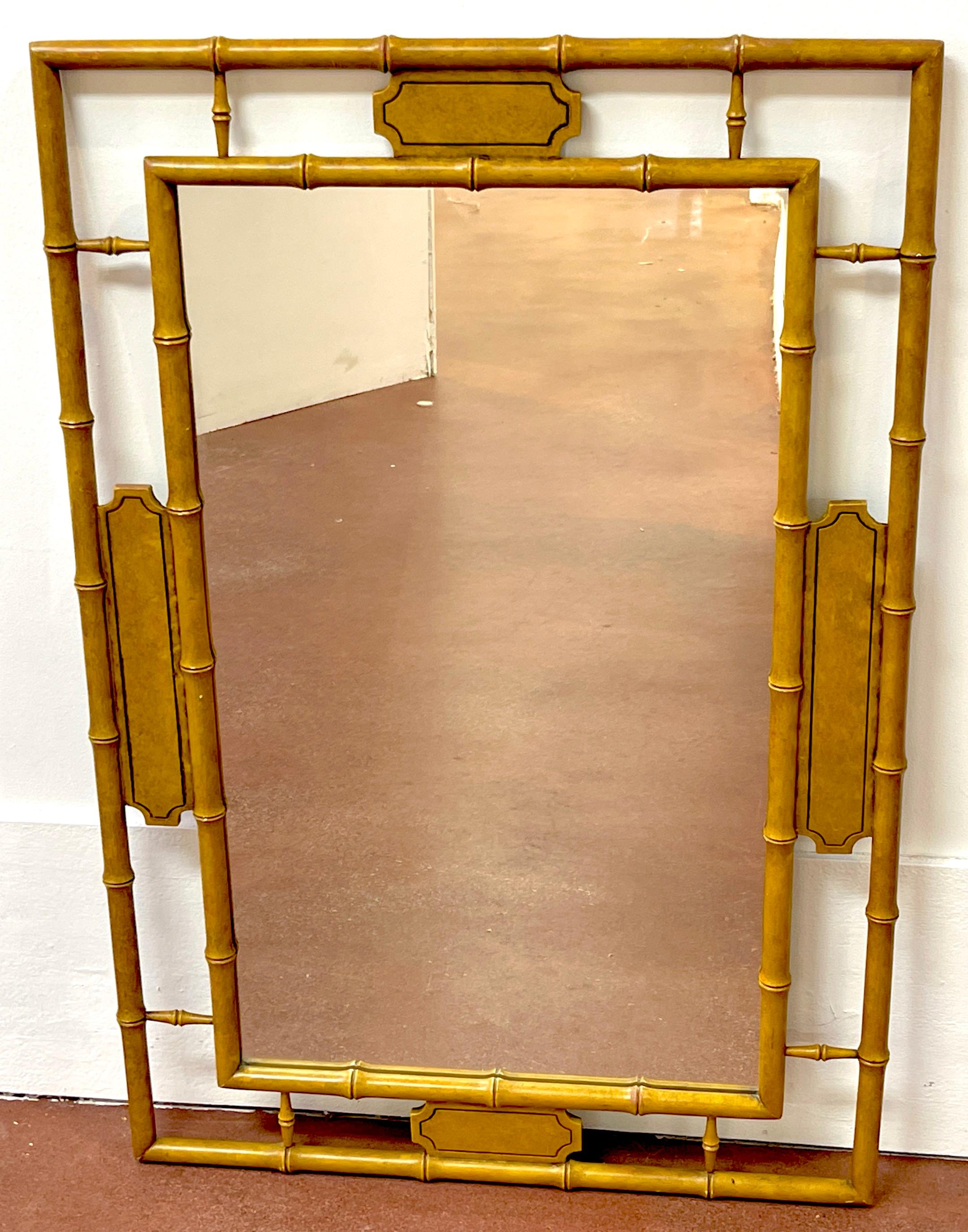 English Regency Style Faux Bamboo Saddle Lacquer Mirror 
England, 20th century 
A beautiful 20th-century English Regency Style Faux Bamboo Saddle Lacquer Mirror is a stunning addition to any interior. Measuring 28 inches in width and 43 inches in