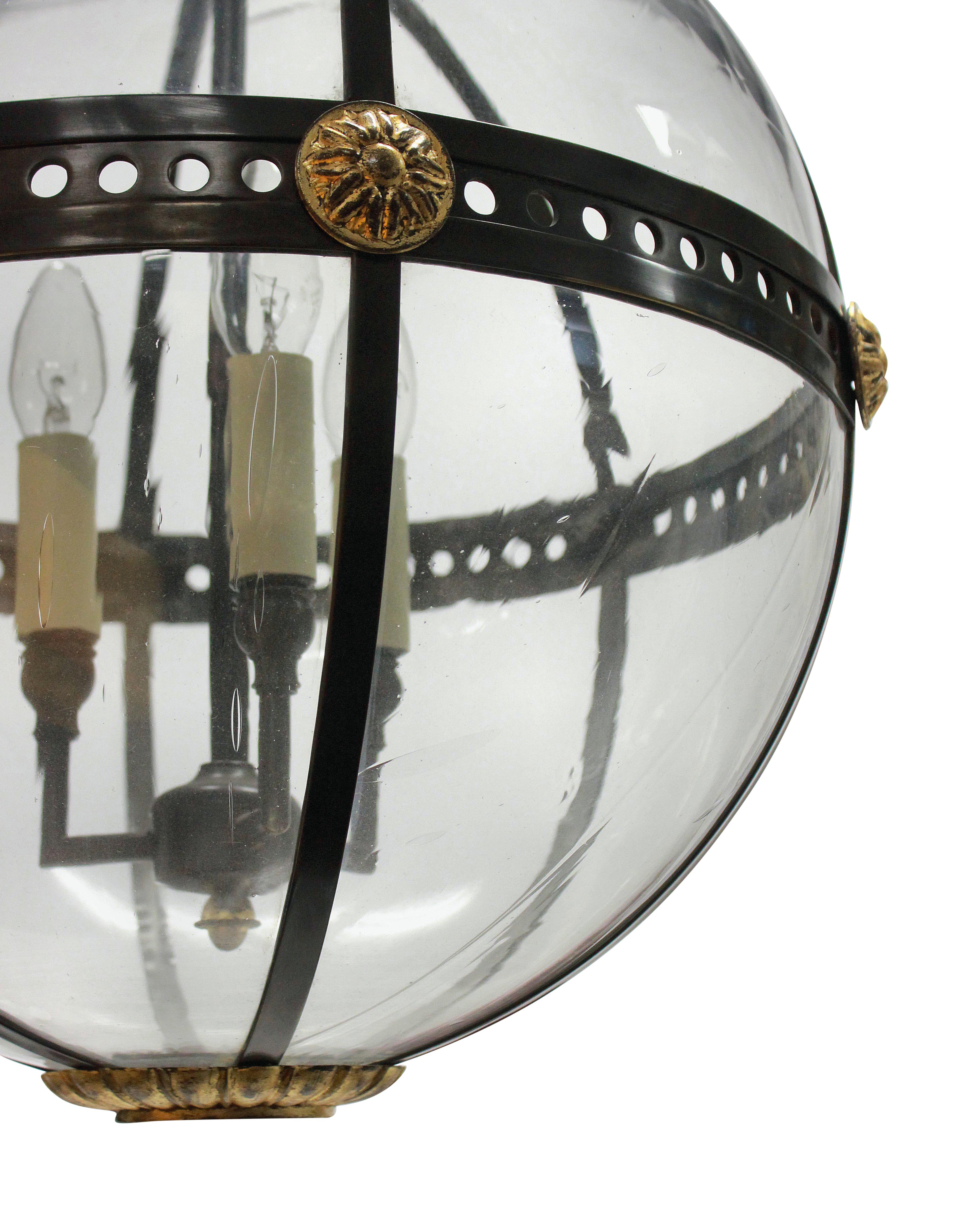 A fine English Regency style bronzed and gilded globe light with hand blown glass panels.