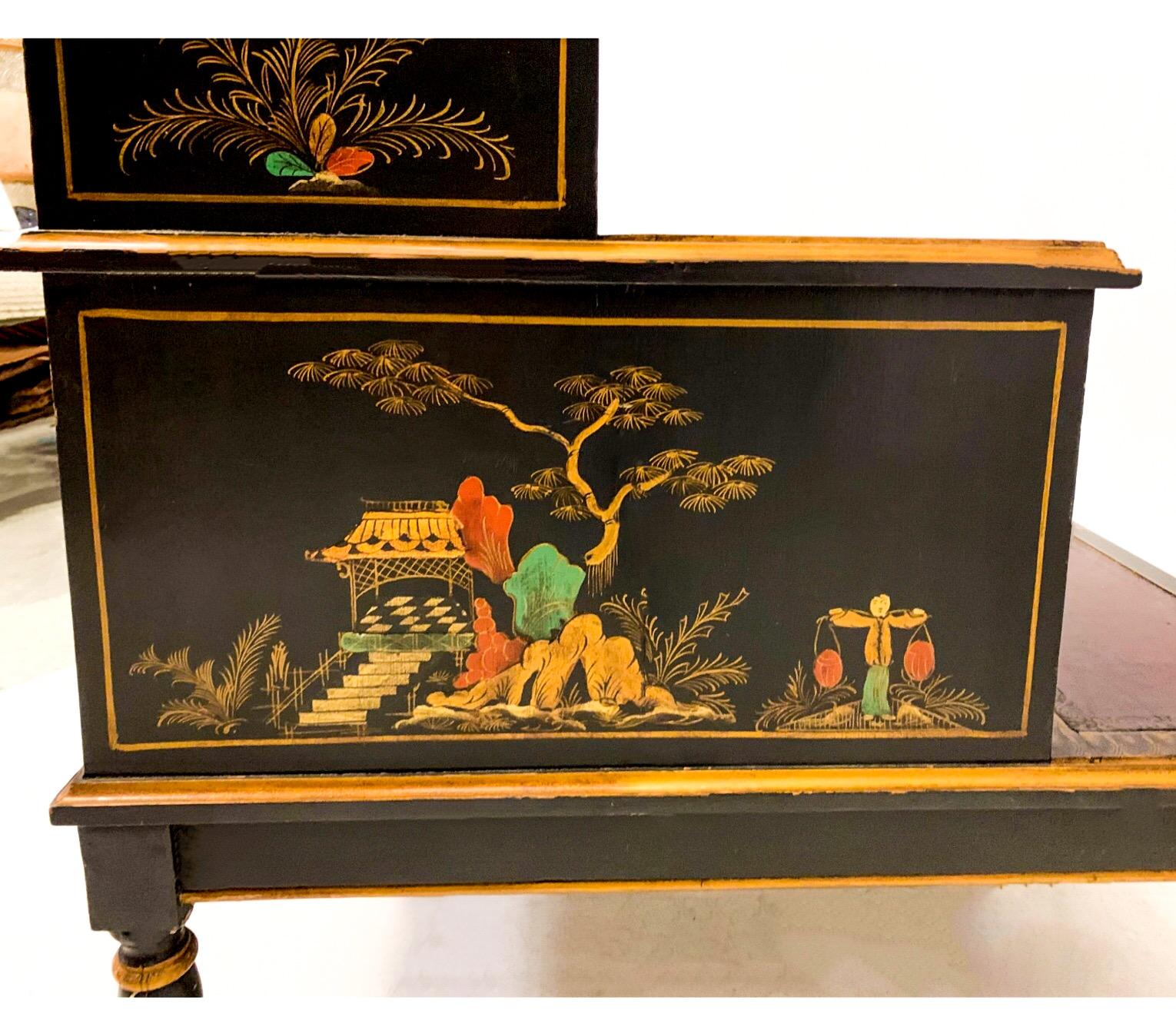 These are lovely. This is a paid of English regency style leather top chinoiserie library steps or side tables. The tooled leather is a burgundy / deep garnet color. There is moderate age wear.