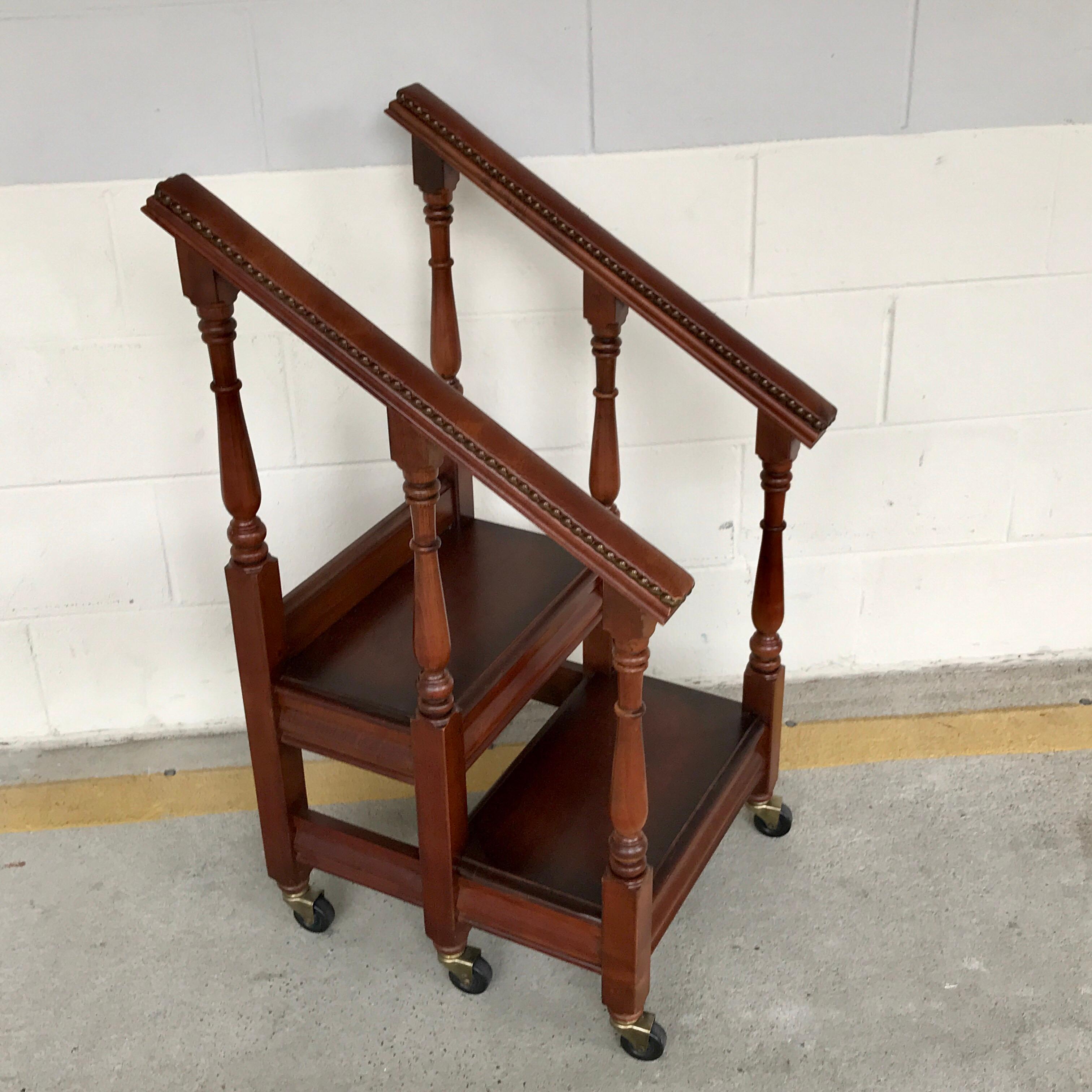English Regency style mahogany and leather rolling library steps, fitted with two 17.5
