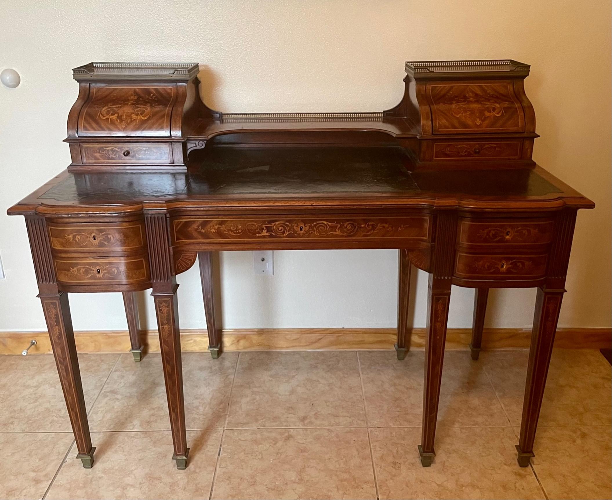 English Regency style mahogany and satinwood inlaid Carlton house desk.

Circa 1880 rare Carlton House desk, typical for the Regency period, is a beautiful piece of furniture. It is exquisitely made of exotic woods and inlaid with rich