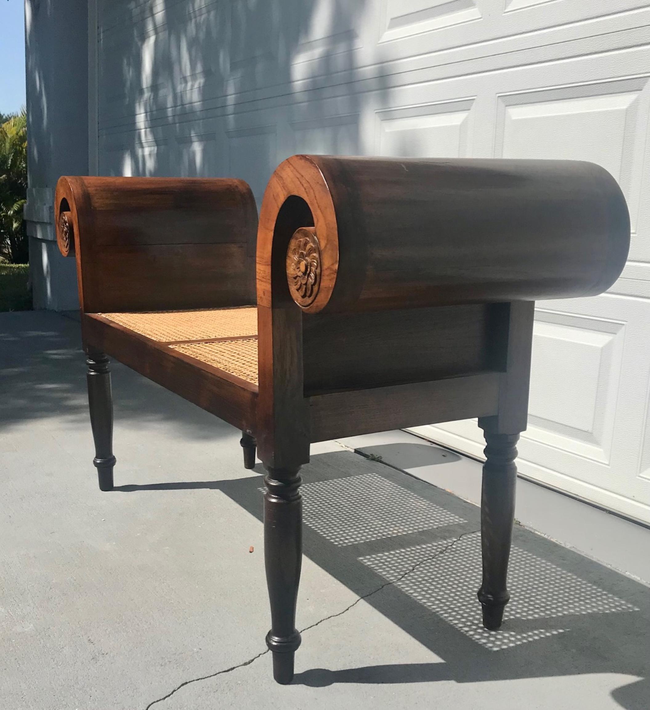 English Regency style mahogany window seat / hall bench.

Impressive Regency style mahogany window seat / hall bench in neoclassical taste.
Both sides have scrolled ends with carved rosettes on turned legs. The divided seats are caned.
The bench is