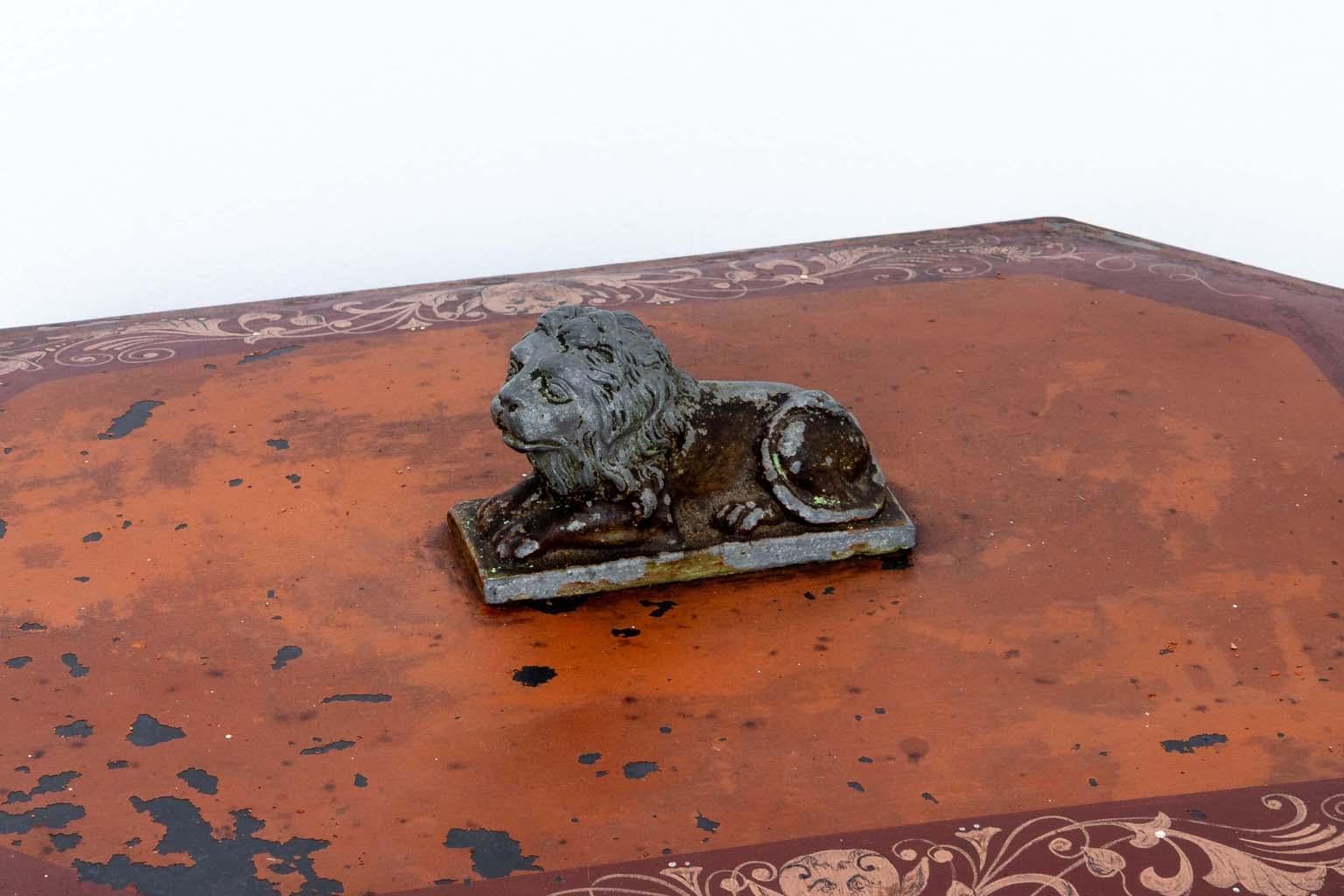 Octagonal painted metal coal scuttle or hod is surmounted by a metal lion handle to open the lid. Would be great for kindling storage. The painted surface is heavily distressed but all original in a wonderful Pompeian red. Wear consistant with age.
