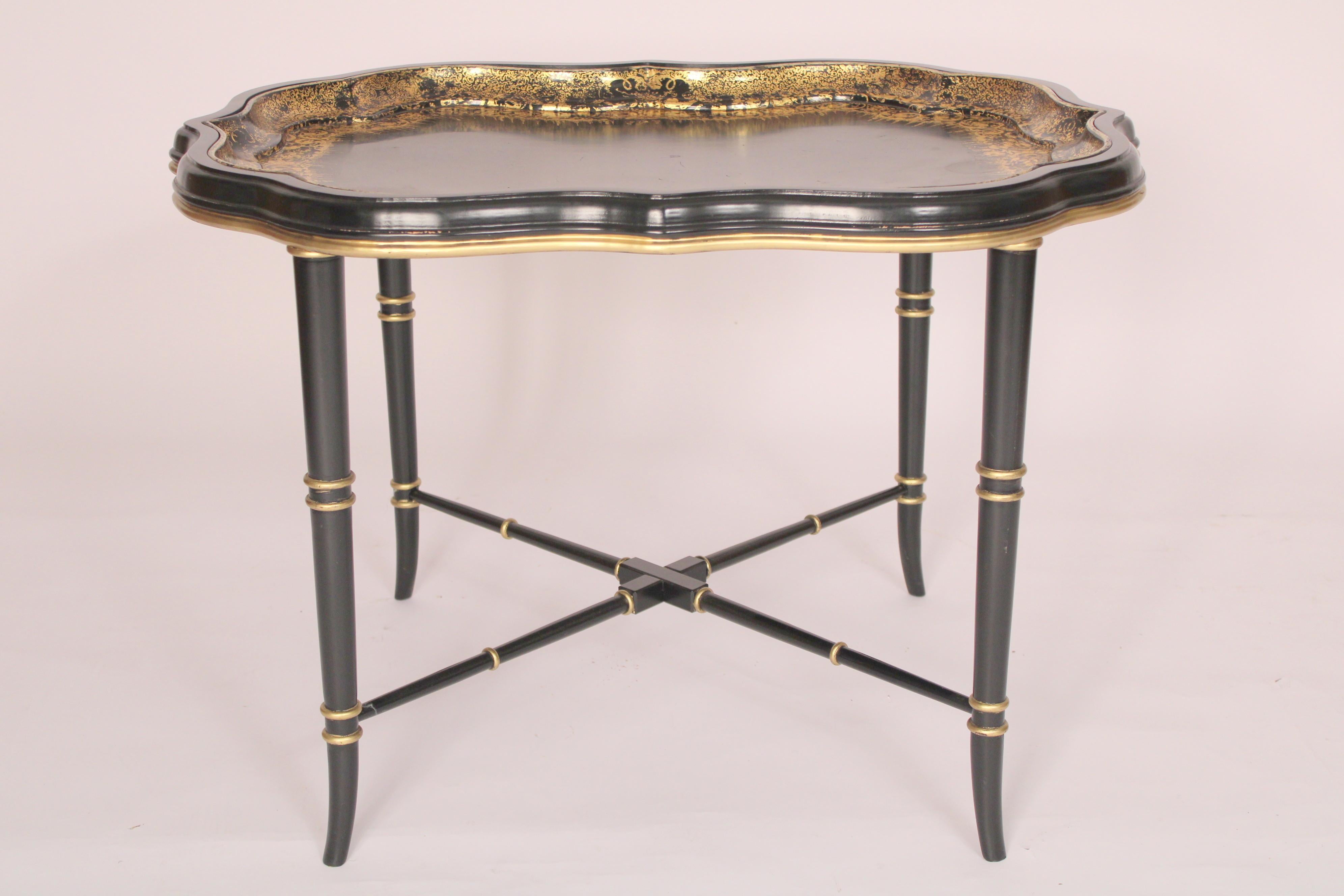 Antique English Regency style paper mache tray made by B. Watson & Co, circa 1900. Now on an English Regency wood, lacquer and painted stand made circa late 20th century.