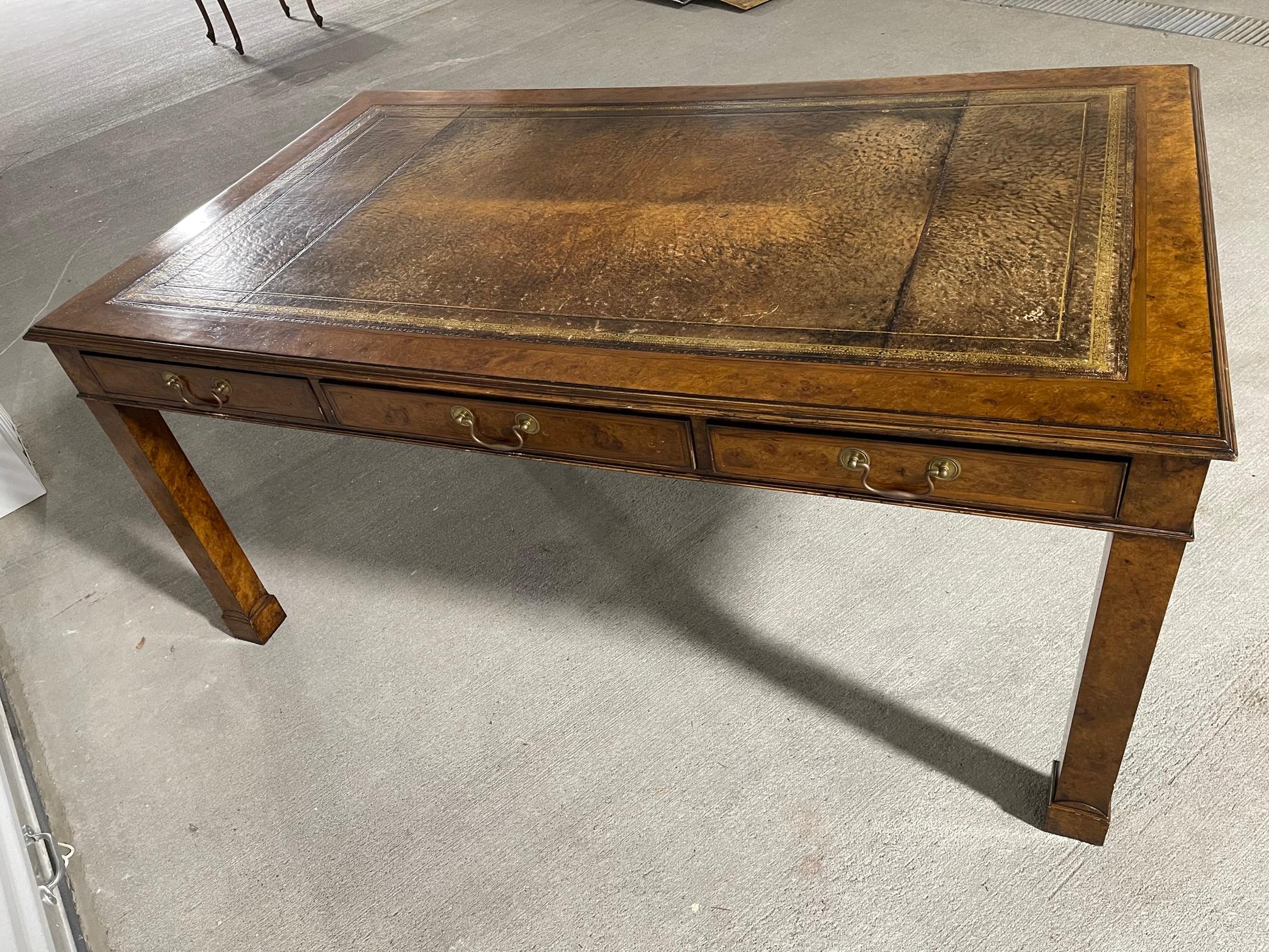 English Regency style partners desk with leather top, 20th century. Height from floor to bottom of drawers is 25